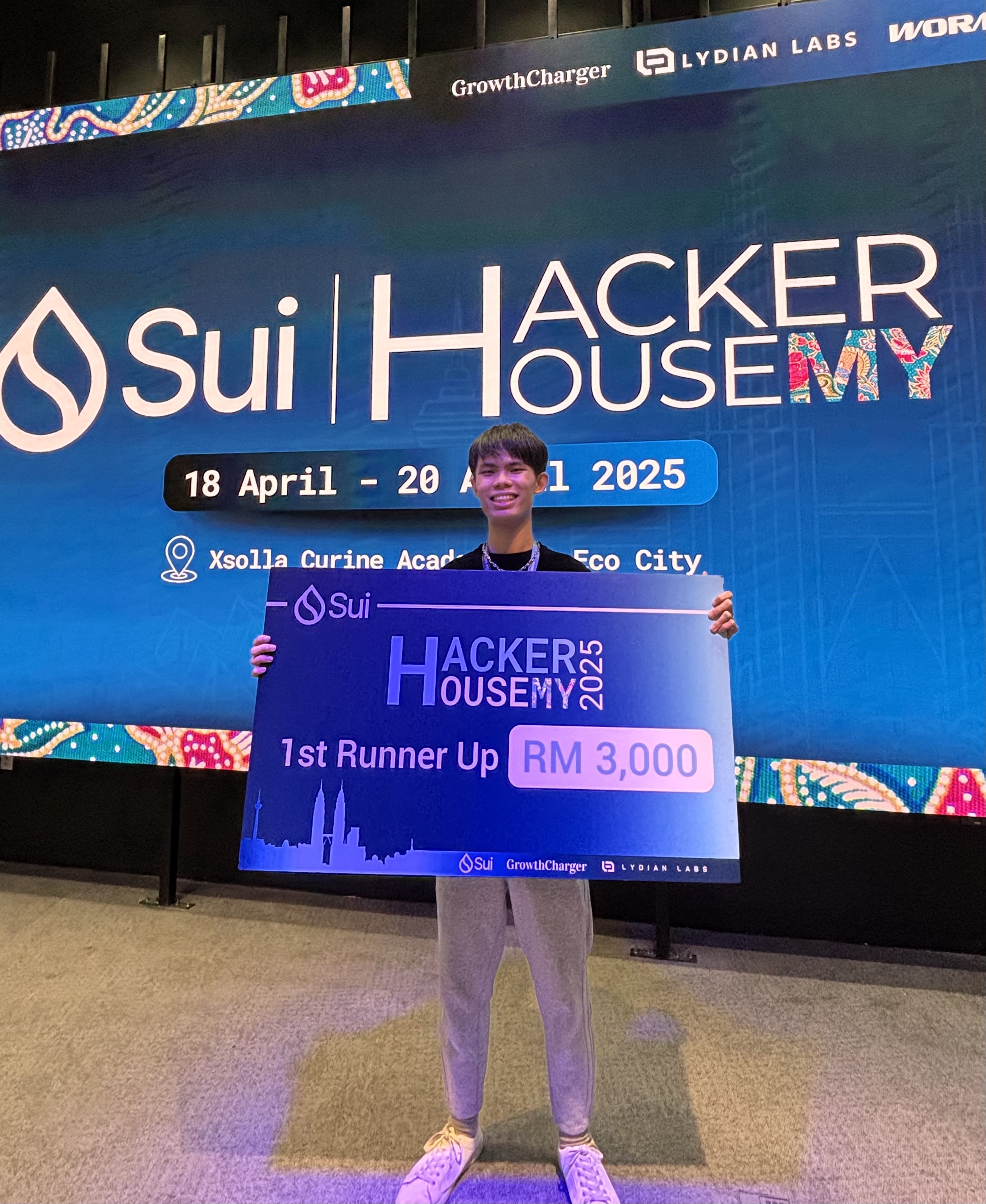 Tan celebrating with his earned prize