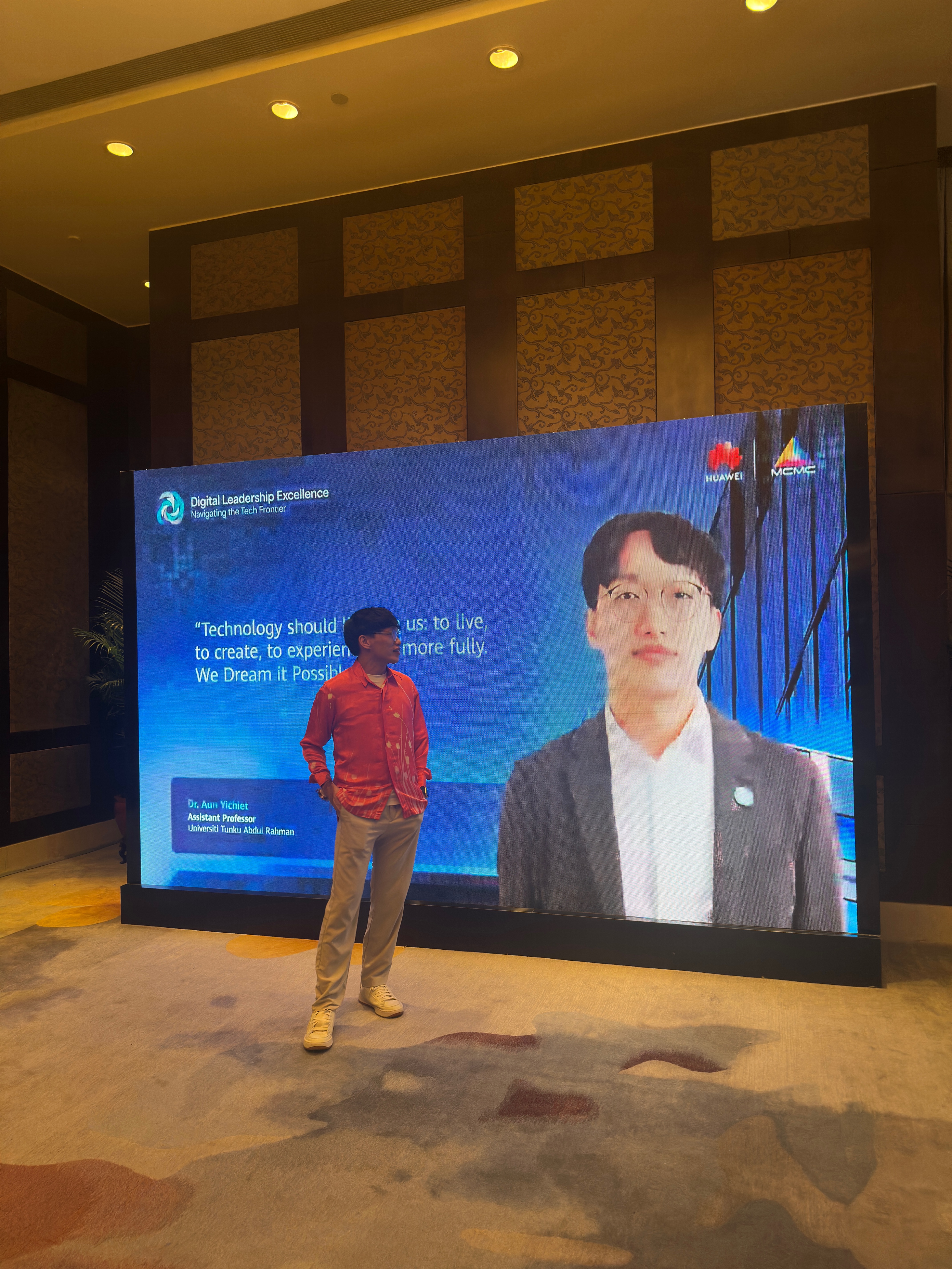 Dr Aun with his digital poster