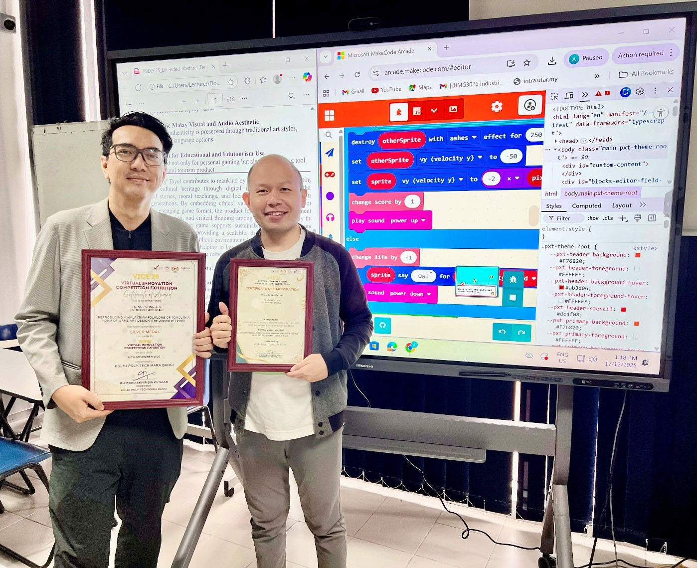 From left: Ts Mohd Fairuz and Ts Ng with the certificates of award and participation