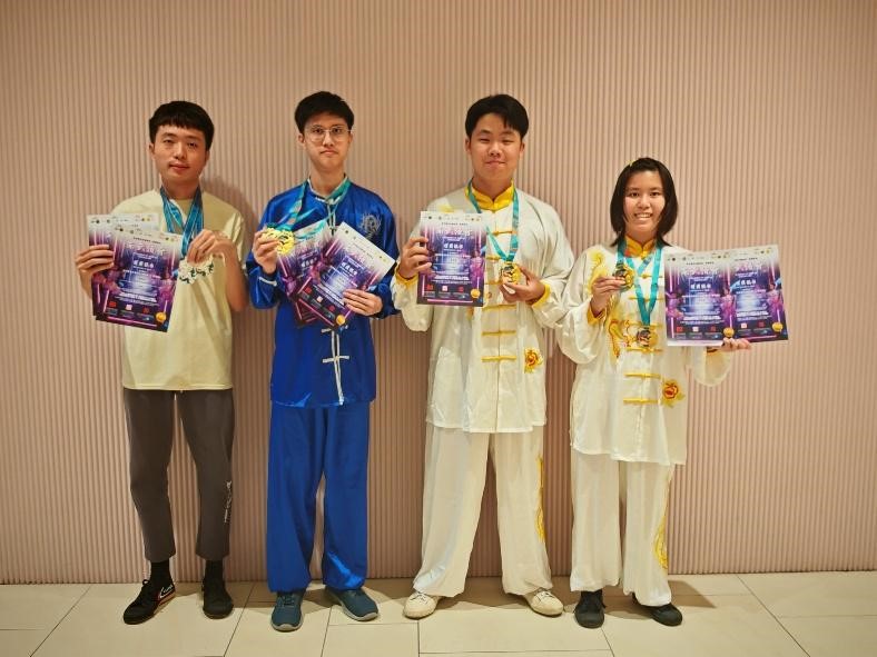 From left: Kerk, Leong, Chai, and Khu displaying their awards with joy