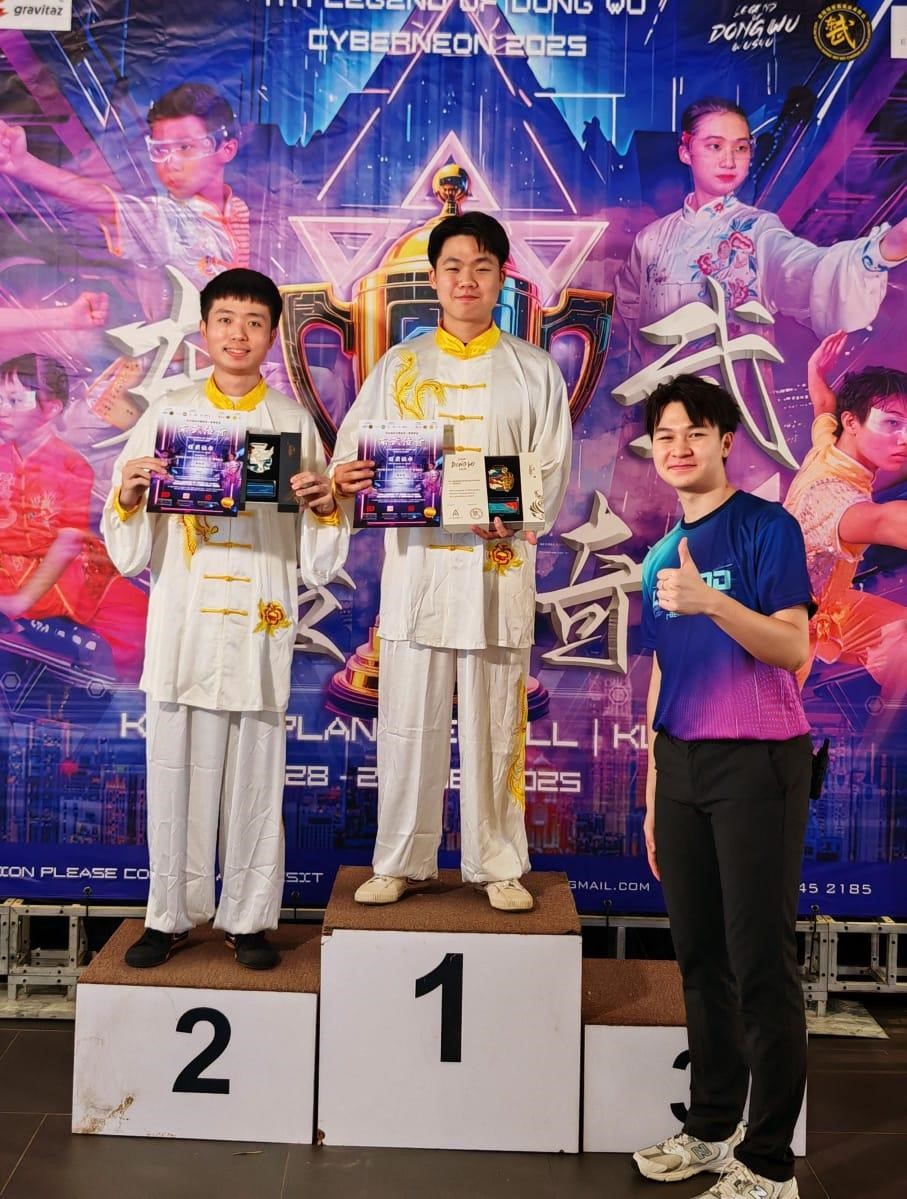 From left (on the podium): Kerk and Chai receiving the prizes for the <i>Yang Style Tai Chi Category</i>