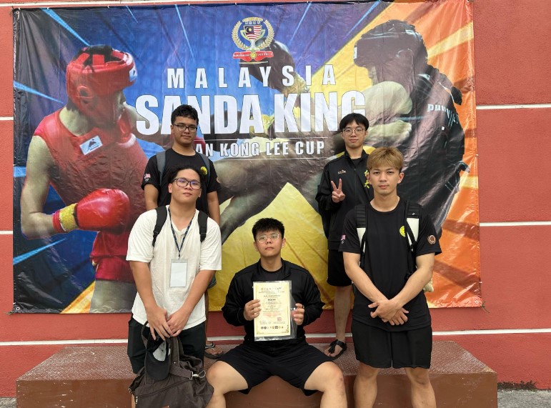 Group photo of UTAR Wushu Club representatives at Sanda King Open Ke-2 2025: