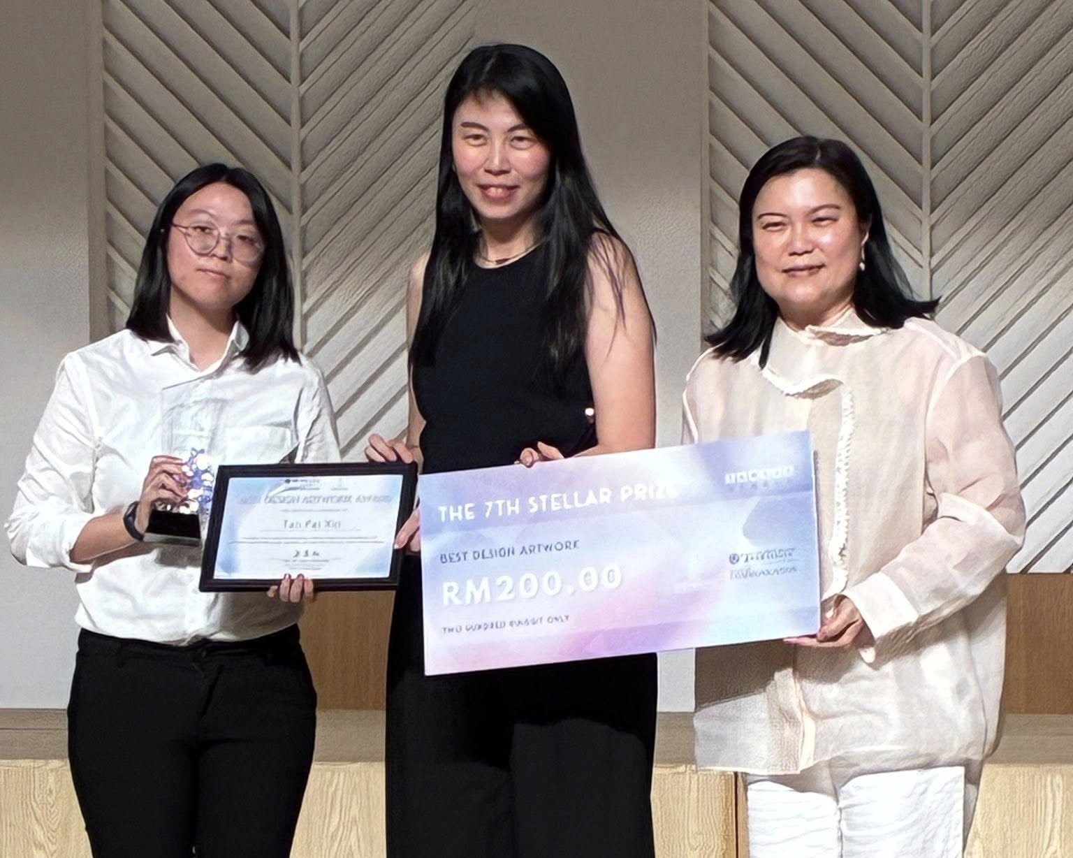 Ms Tan (most left) receiving her certificates and trophy from organisers