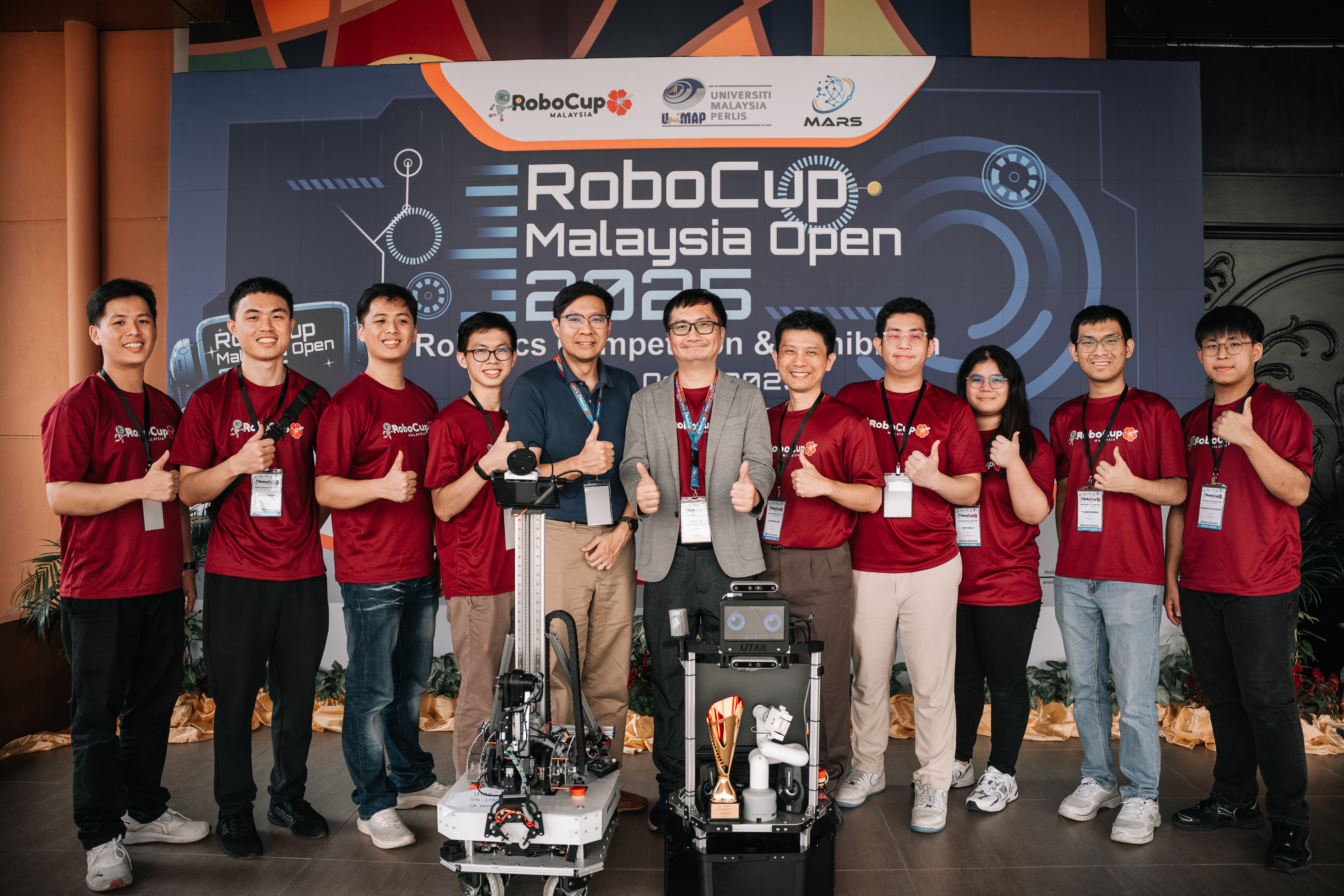 From left: Lim Zi Jun, Er Kai Sheng, Lim Zi Quan, Ooi Soo Jack, Dr Danny Ng, President of RoboCup Malaysia (Malaysia AI Robotics Society) Prof Jeffrey Tan Too Chuan, Dr Kwan, Liew Kai Hin, Tan Yong Ji, Chong Ken Wai, and Charles Toh Chao Wei