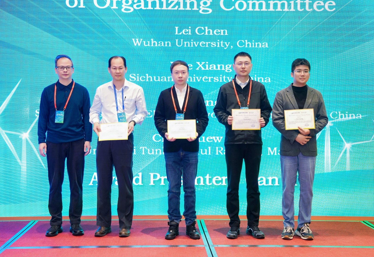 Dr Chew (second from left) receiving the Excellent Reviewer Award