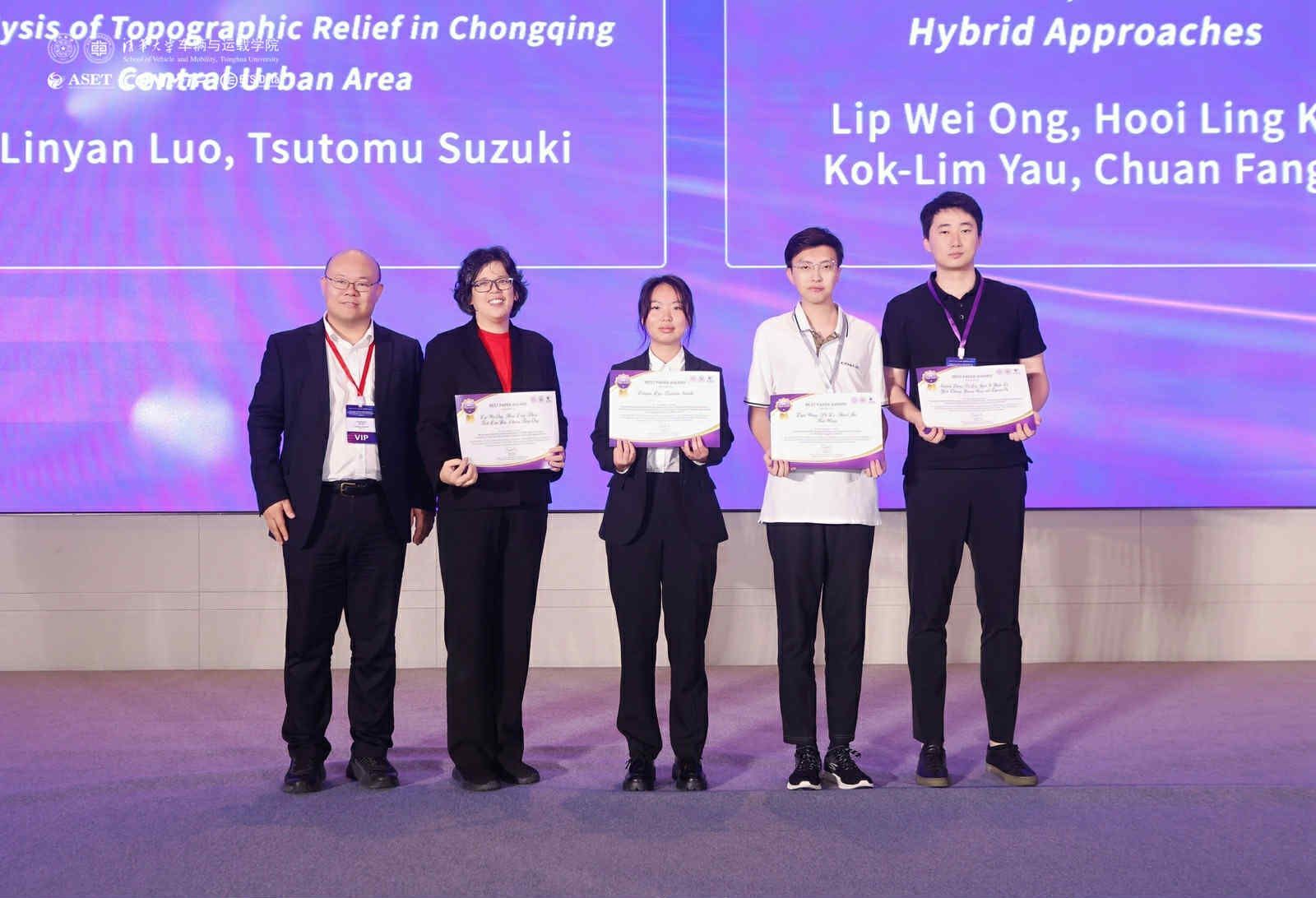 Prof Khoo (second from left) with her award certificate