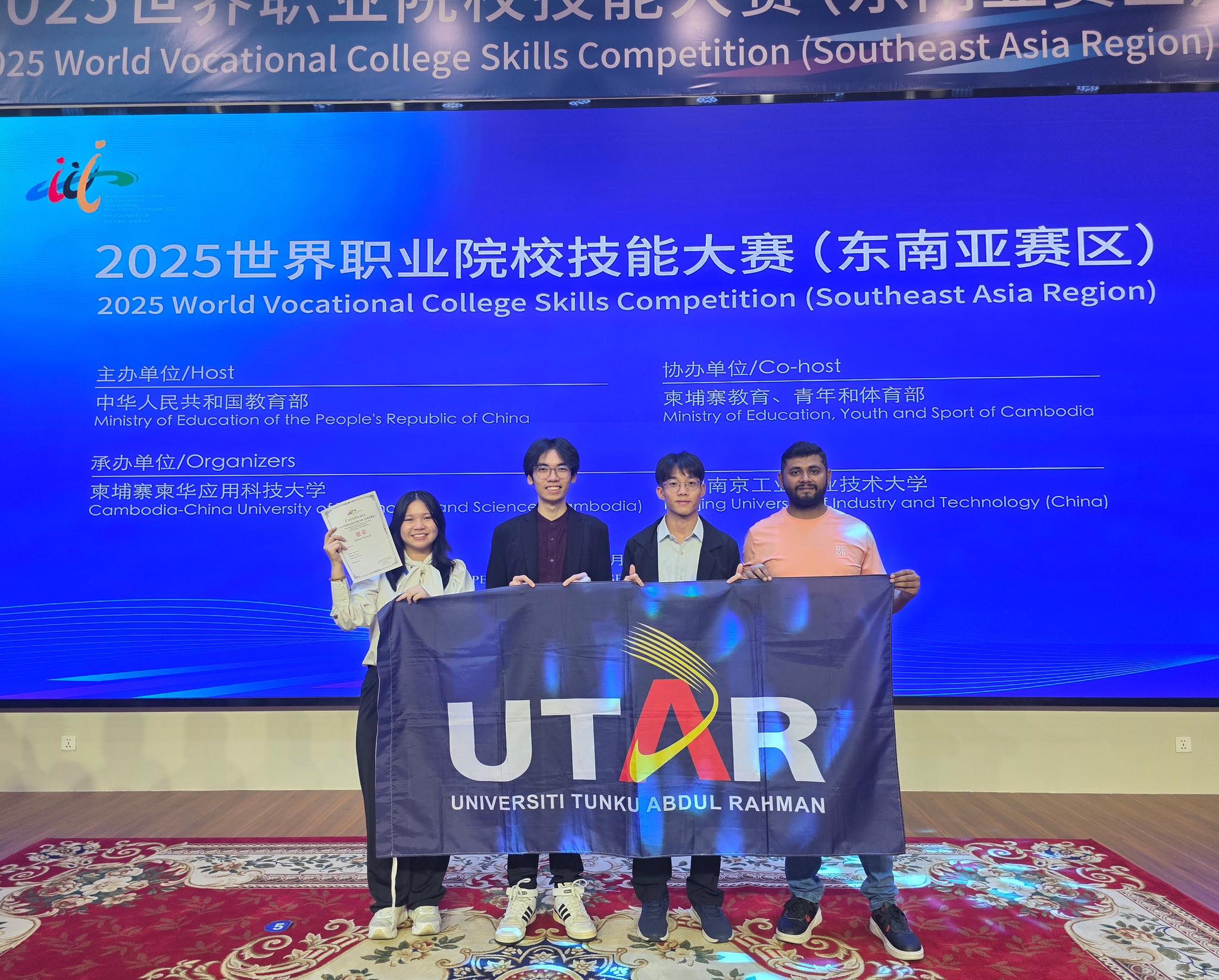 Silver win for the FICT team (from left): Vianne Chong, Beh, Thai, and their supervisor Dr Nadeem