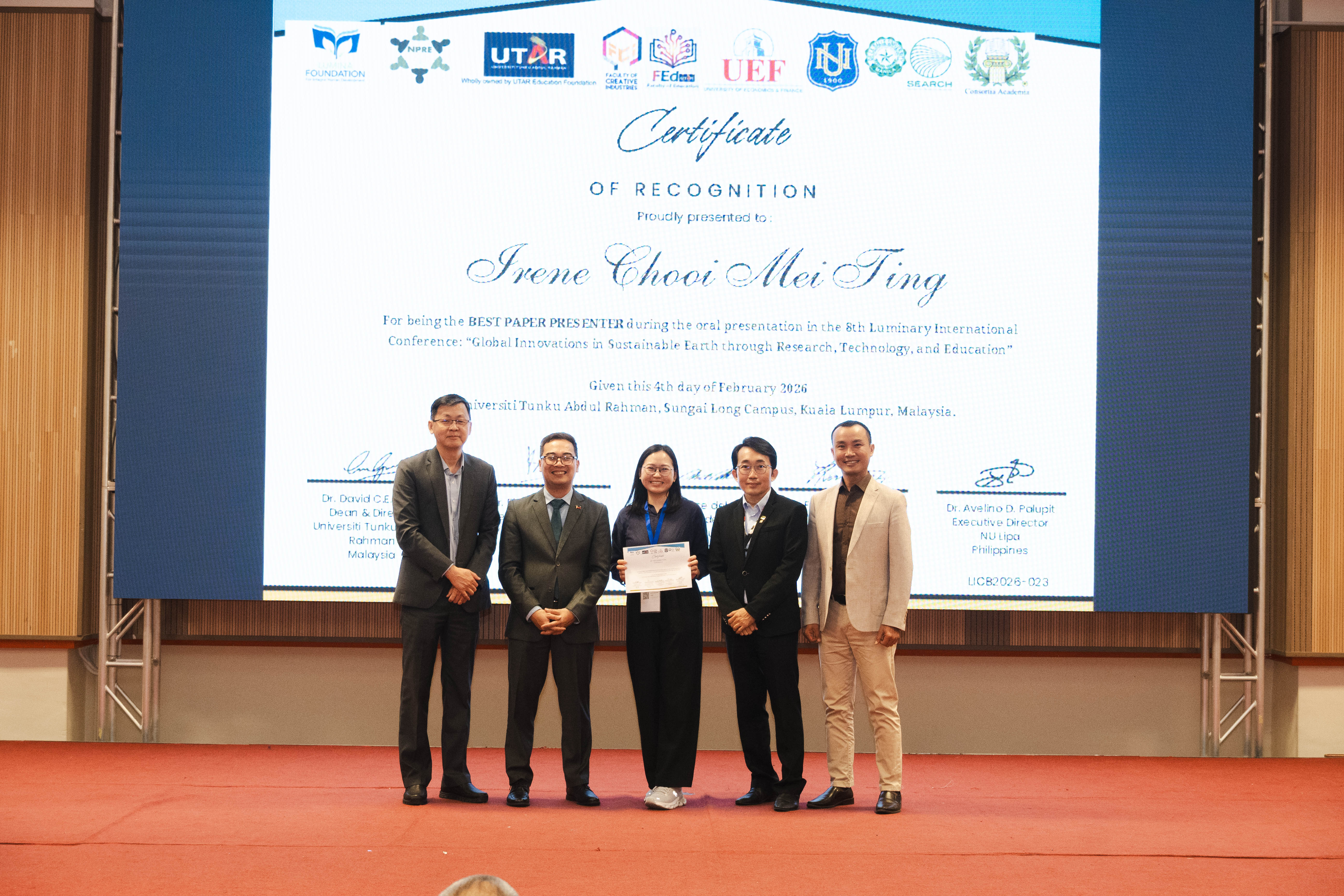 Irene Chooi (third from left) receiving her certificate