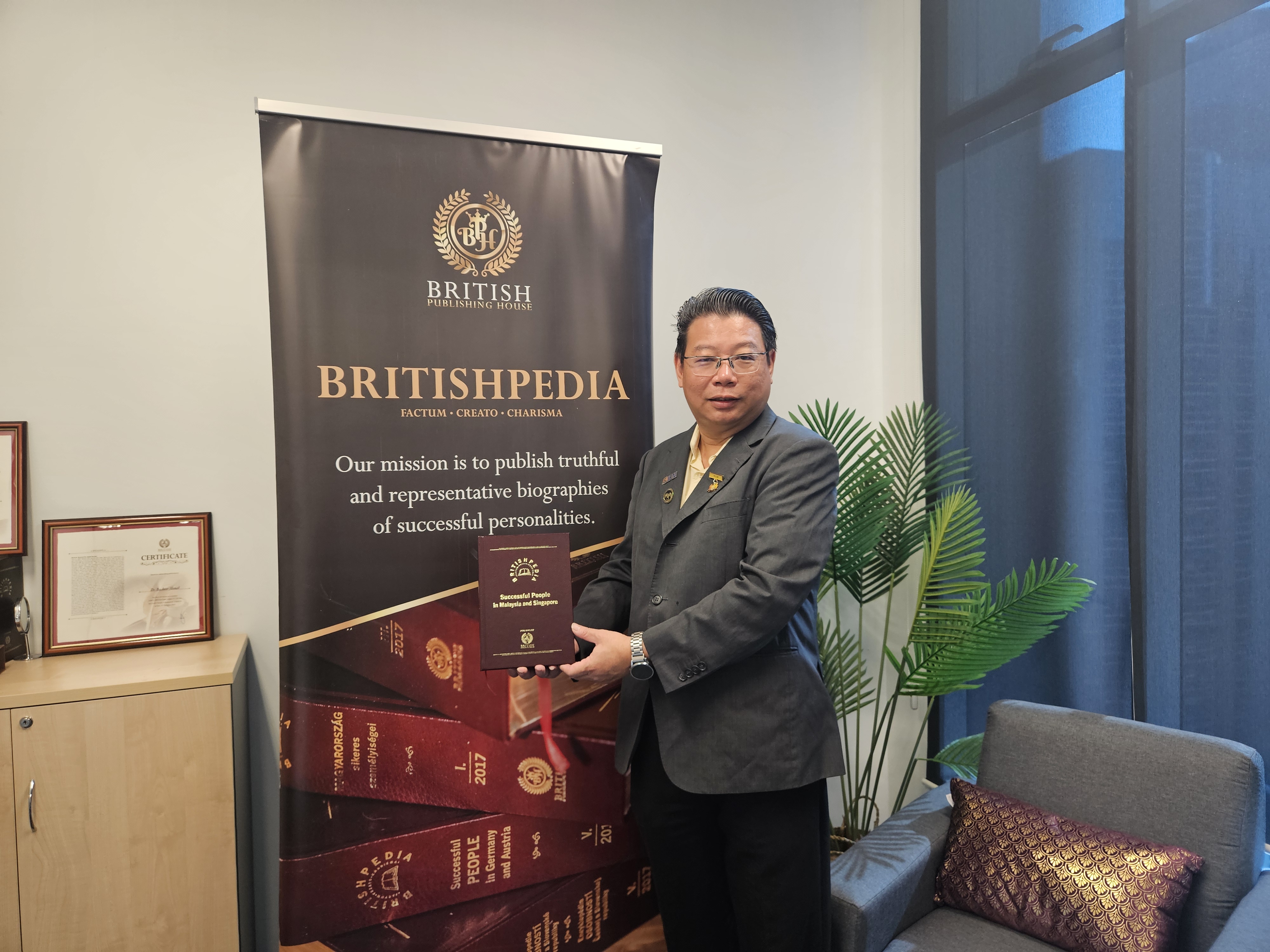 Dr Wong with the Britishpedia Biographical Encyclopaedia: Successful People in Malaysia and Singapore (Volume VII, 2025), 
