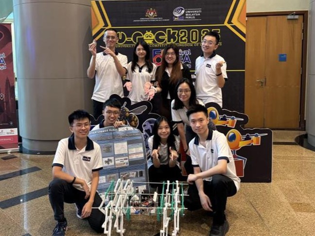 Legged Robot Team with their robot
