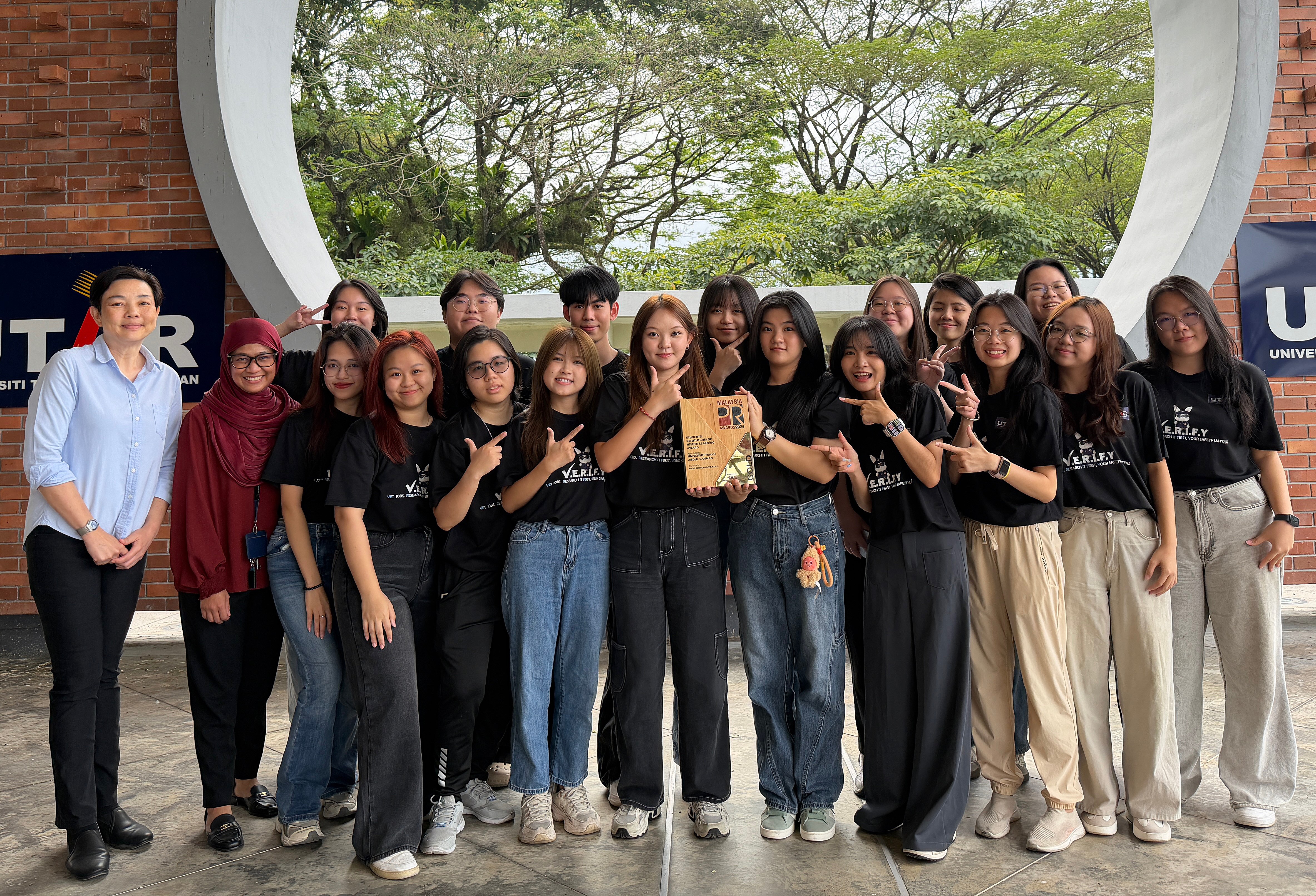 Celebrating their win at the Malaysia Public Relations Awards 2025, Revellyn Tan Jie Xin (centre) and her team, Prof Dr Cheah Phaik Kin (far left), and Ms Bazlin Darina binti Ahmad Tajudin, Head of Department, Department of Public Relations (second from left)