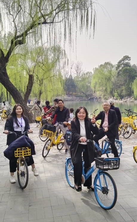 A cycling tour around the picturesque campus of THU with Aw (far left) and Ong