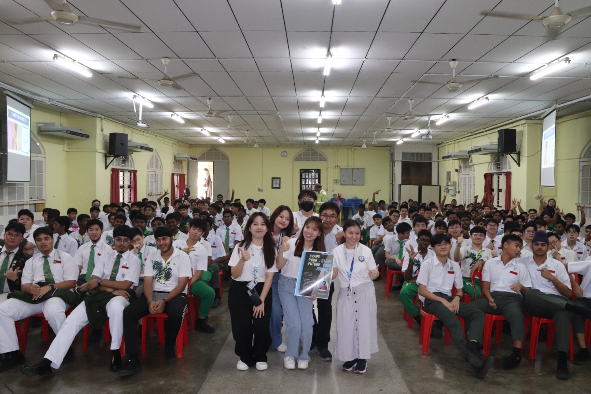 Students, guests and committee members taking a group photo after the talk