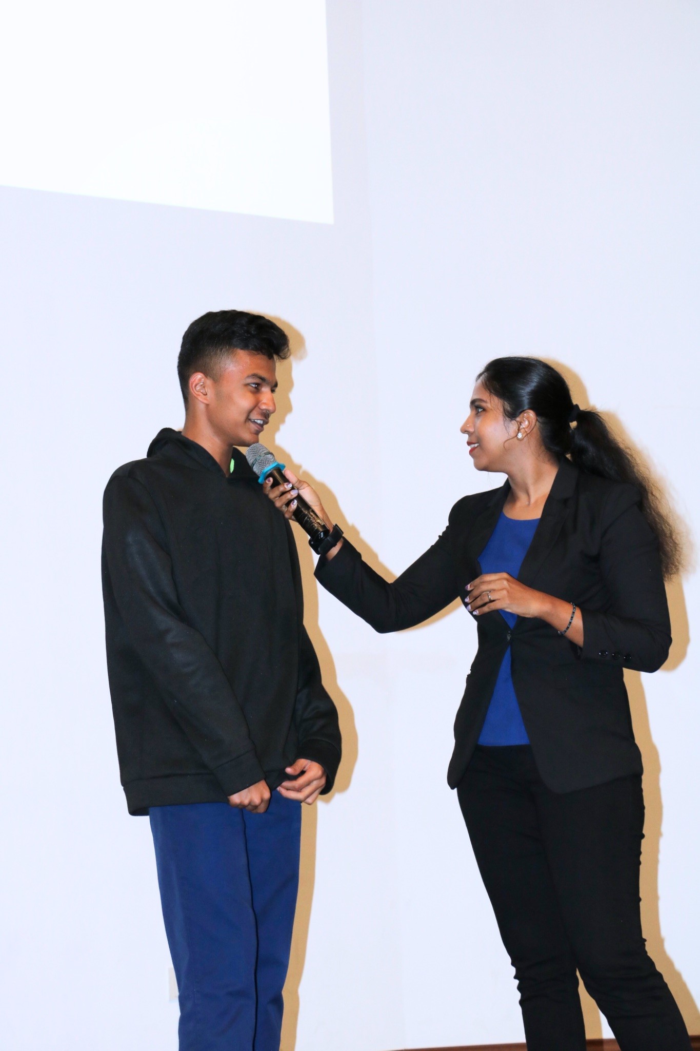Ms Sanggari inviting students on stage for an engaging Q&A session