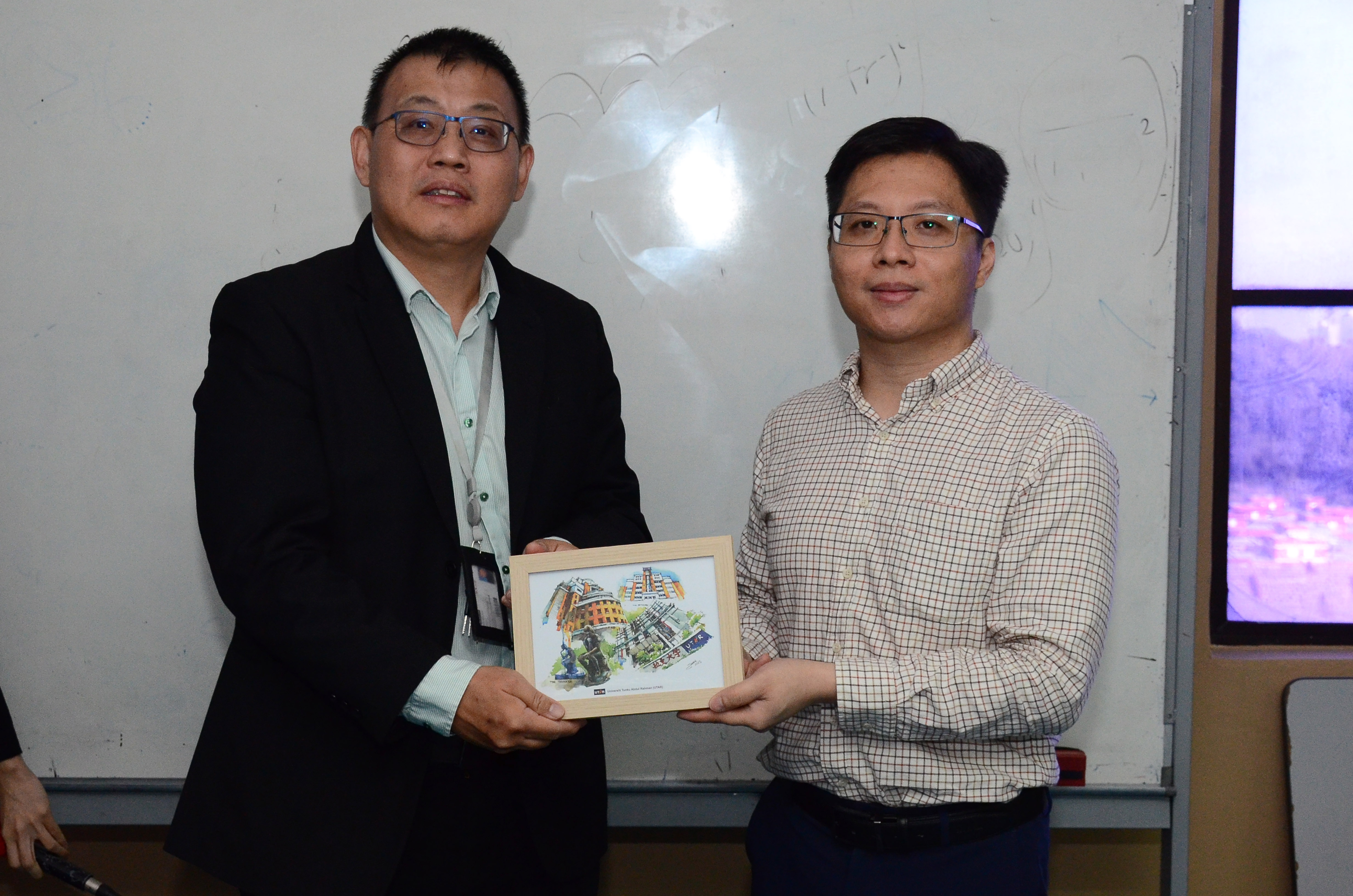 Souvenir presentation to Dr Tee