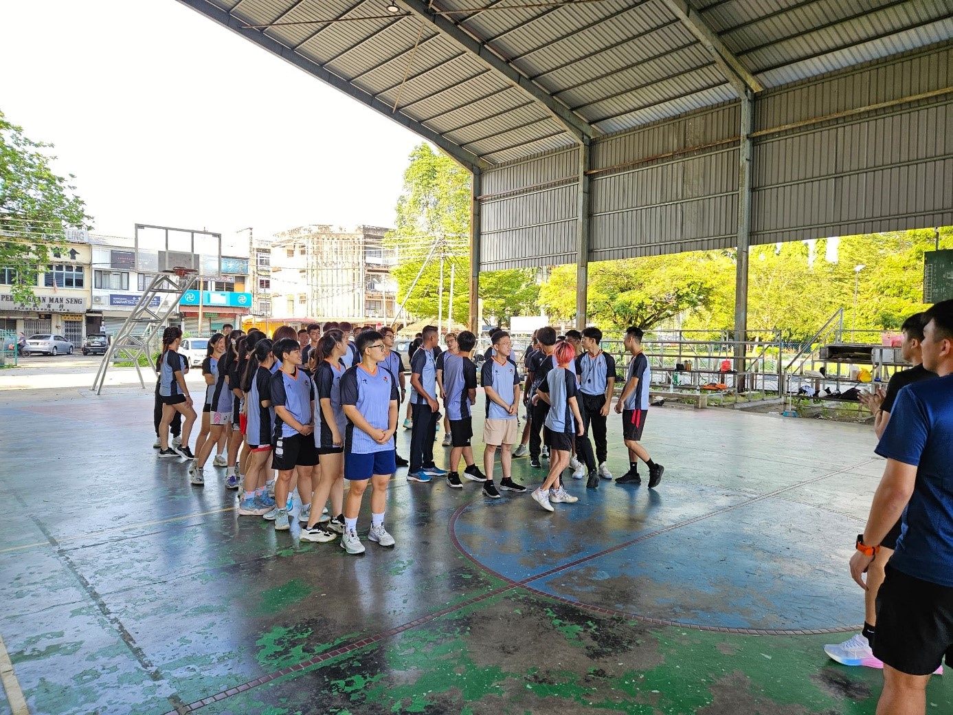 Participants, in groups, engaging in hands-on practice to apply their refereeing skills