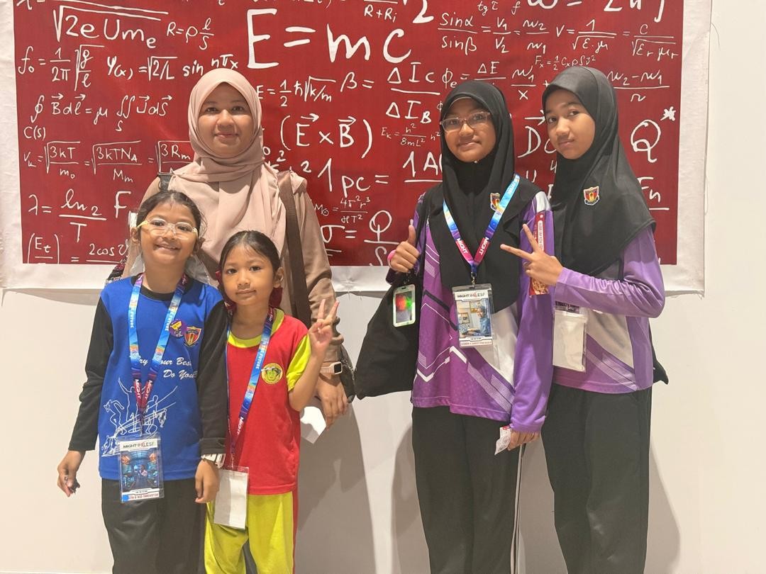 Puan Nur Amalina with her children and their friend