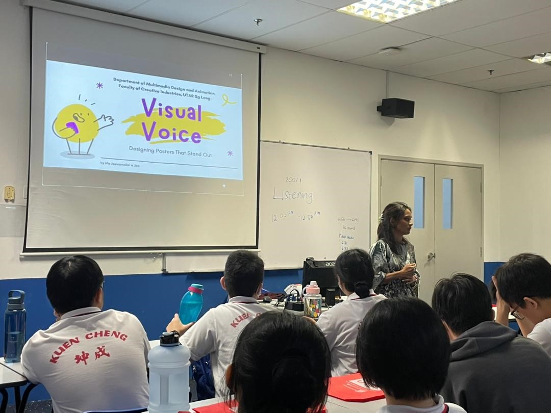 Ms Jeevamalar guiding students in poster design