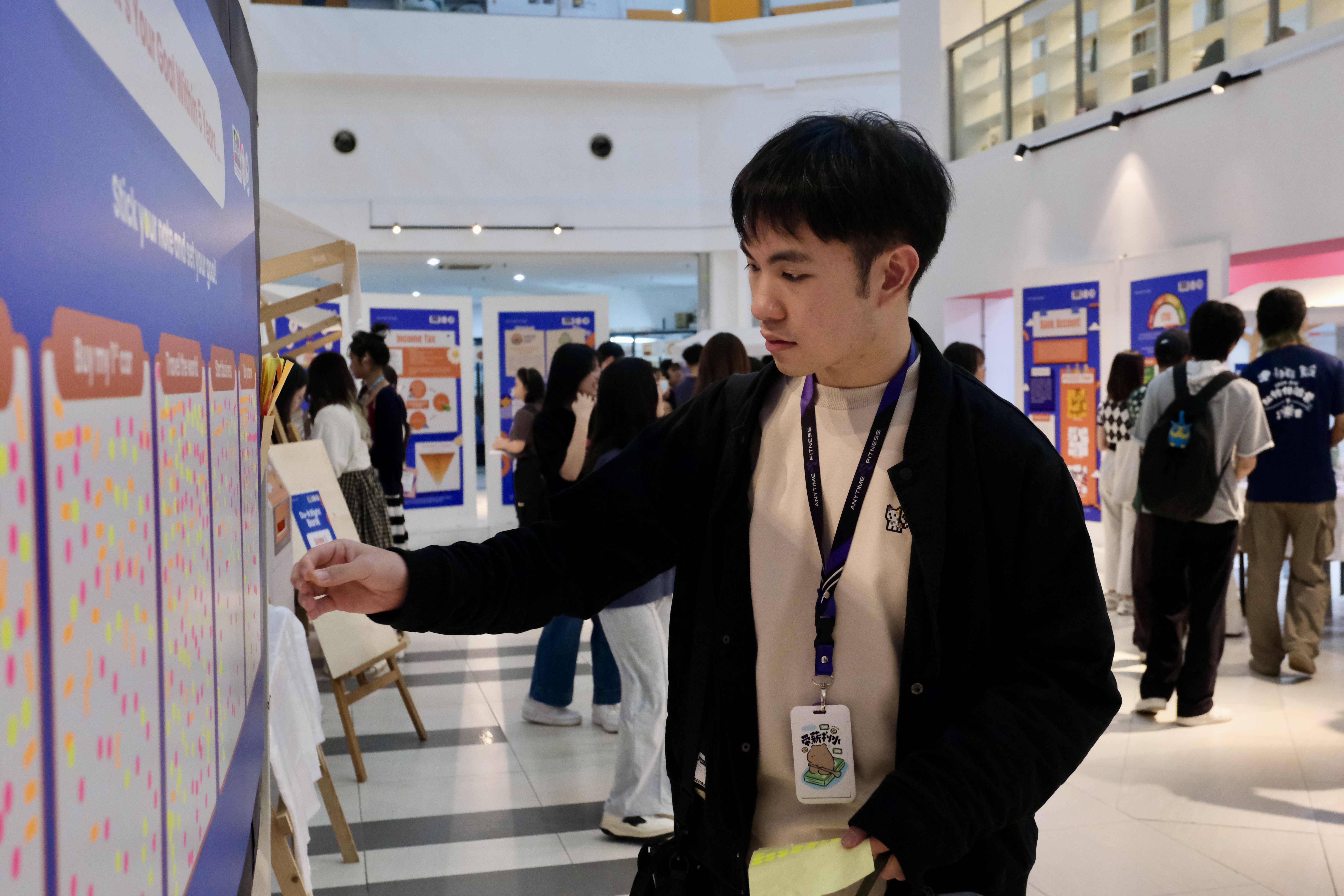 A participant mapping out future aspirations at the campaign’s Interactive Goal Board