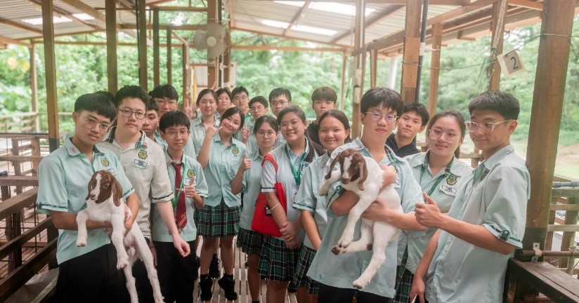 Students visiting the goat breeding facility