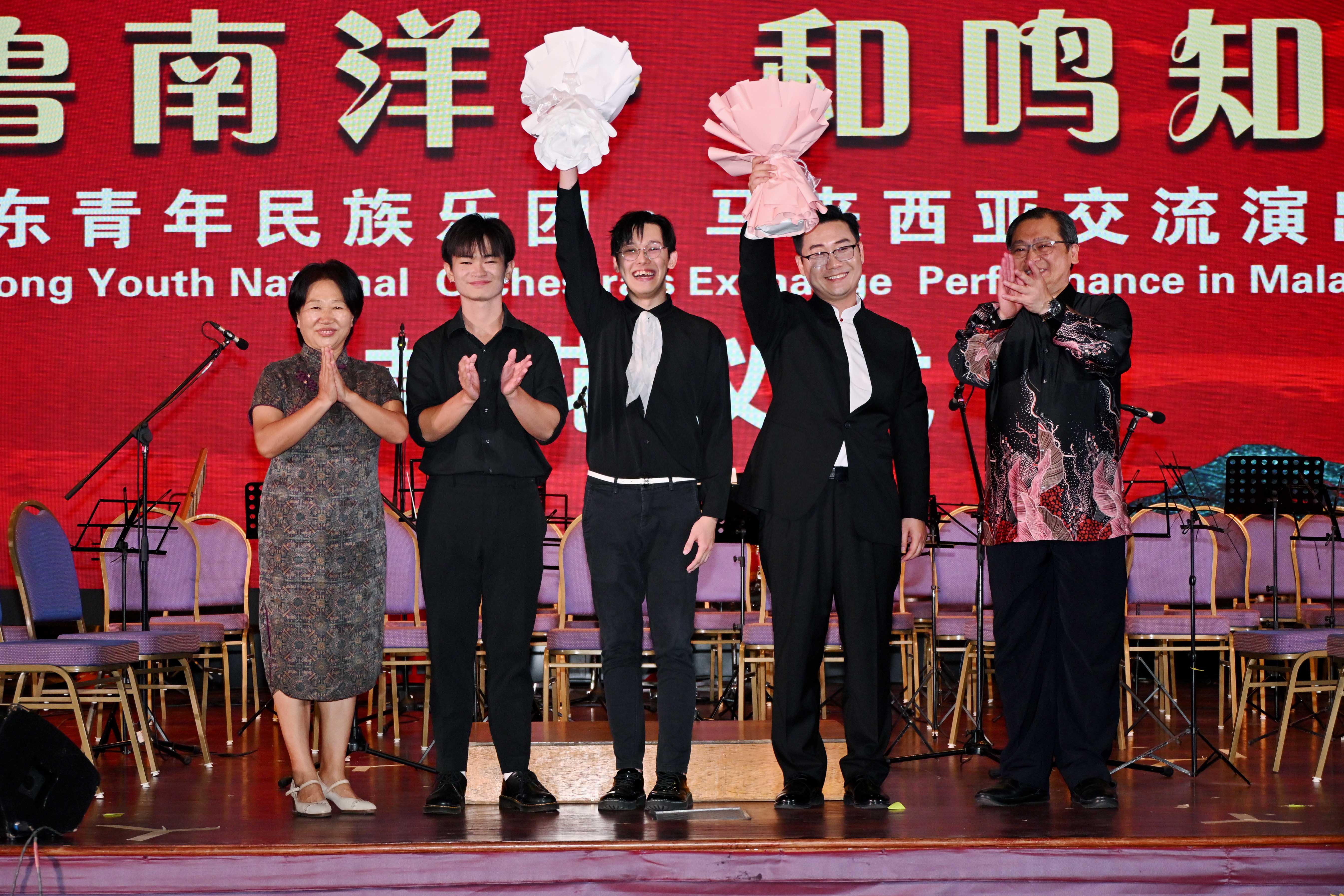 The three conductors: Seng (second from left), See, and Assoc Prof Liu, celebrating the success of the concert with Prof Ma Yingxin (far left) and Dr Chong (far right)