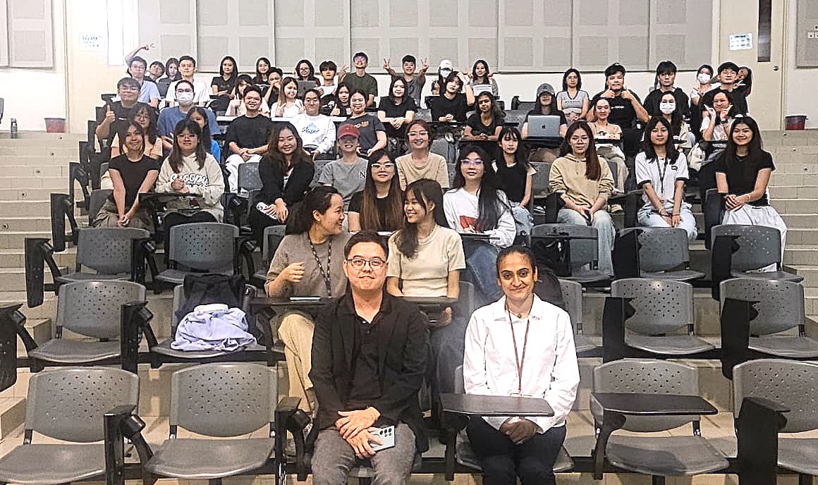 Mr Tan and Ms Aruna (front row) with students following a meaningful exchange