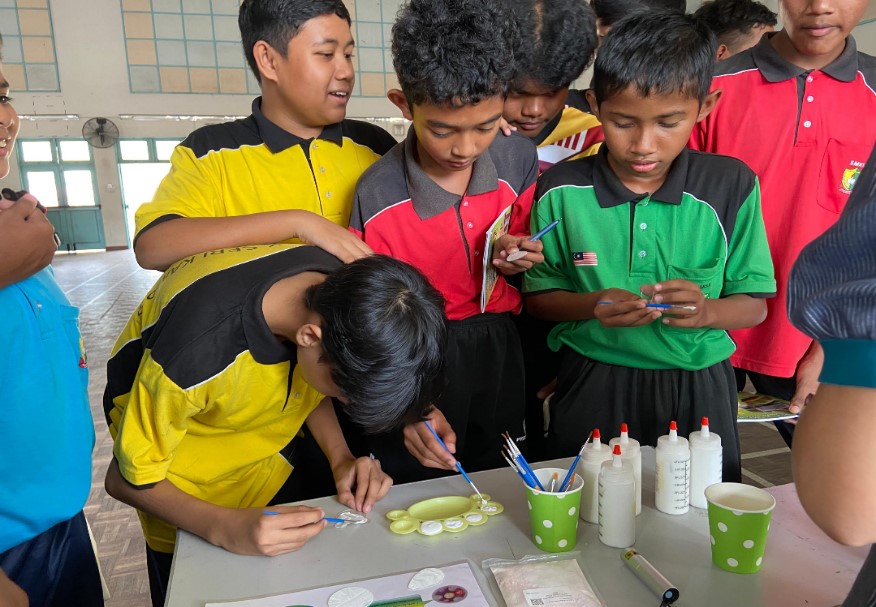 Students experimenting on colours using heat and light
