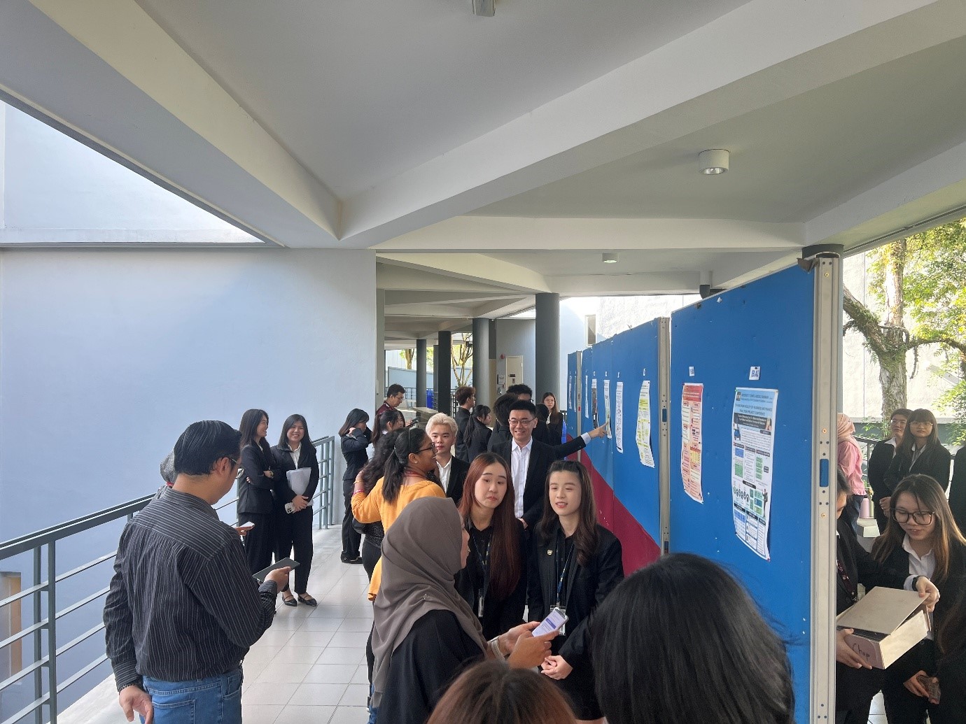 Students presenting their FYP posters