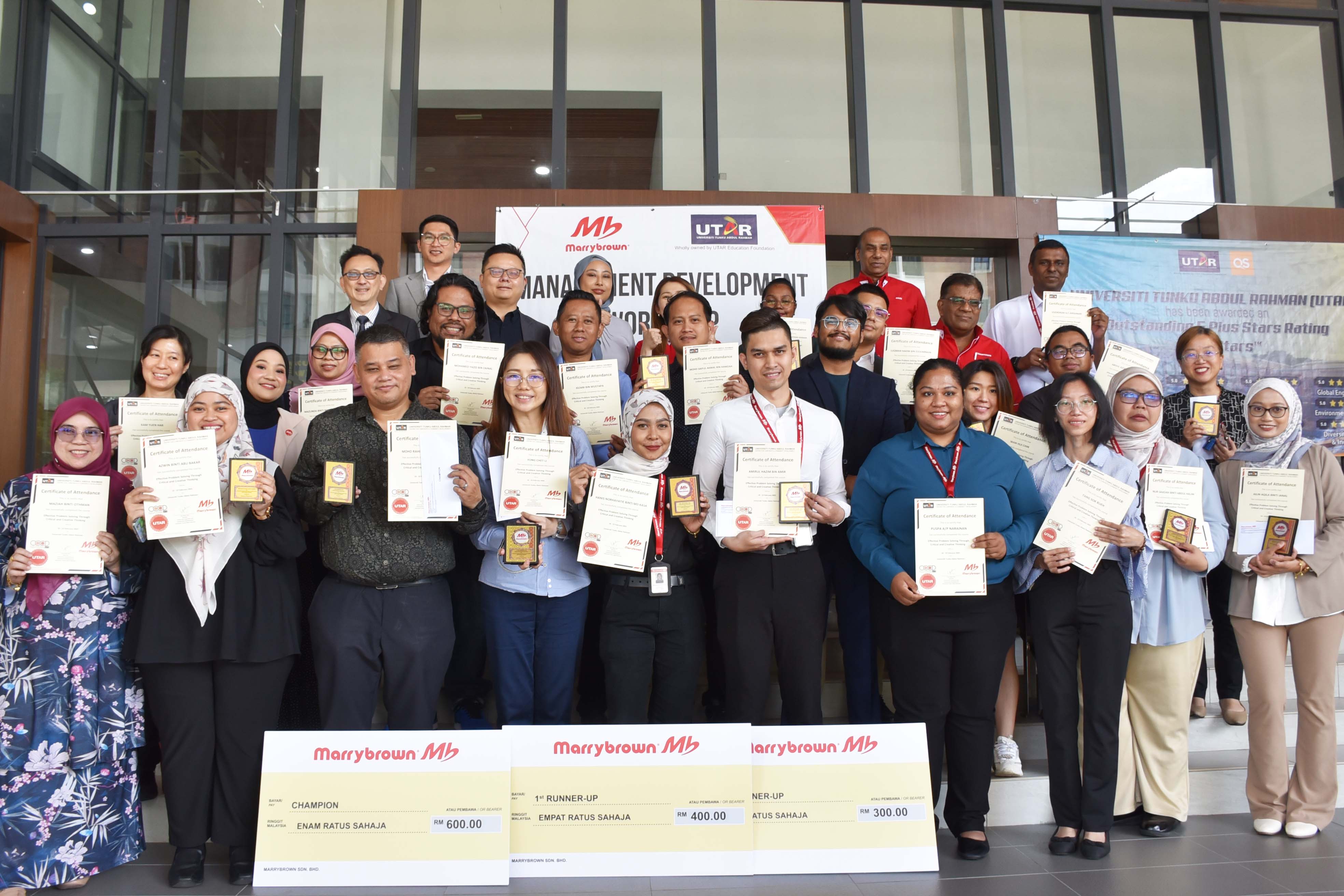 Participants displaying their certificates 