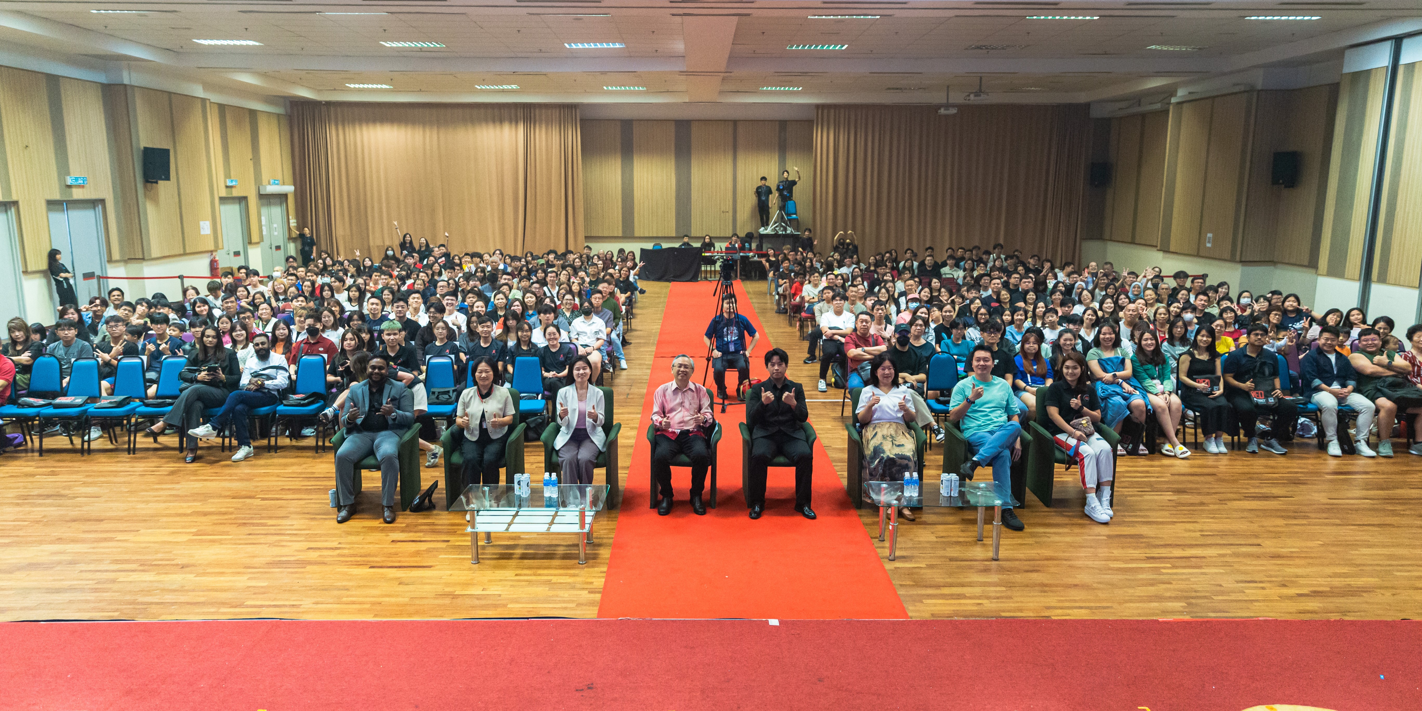 Performers and audience captured in a moment of joy and unity