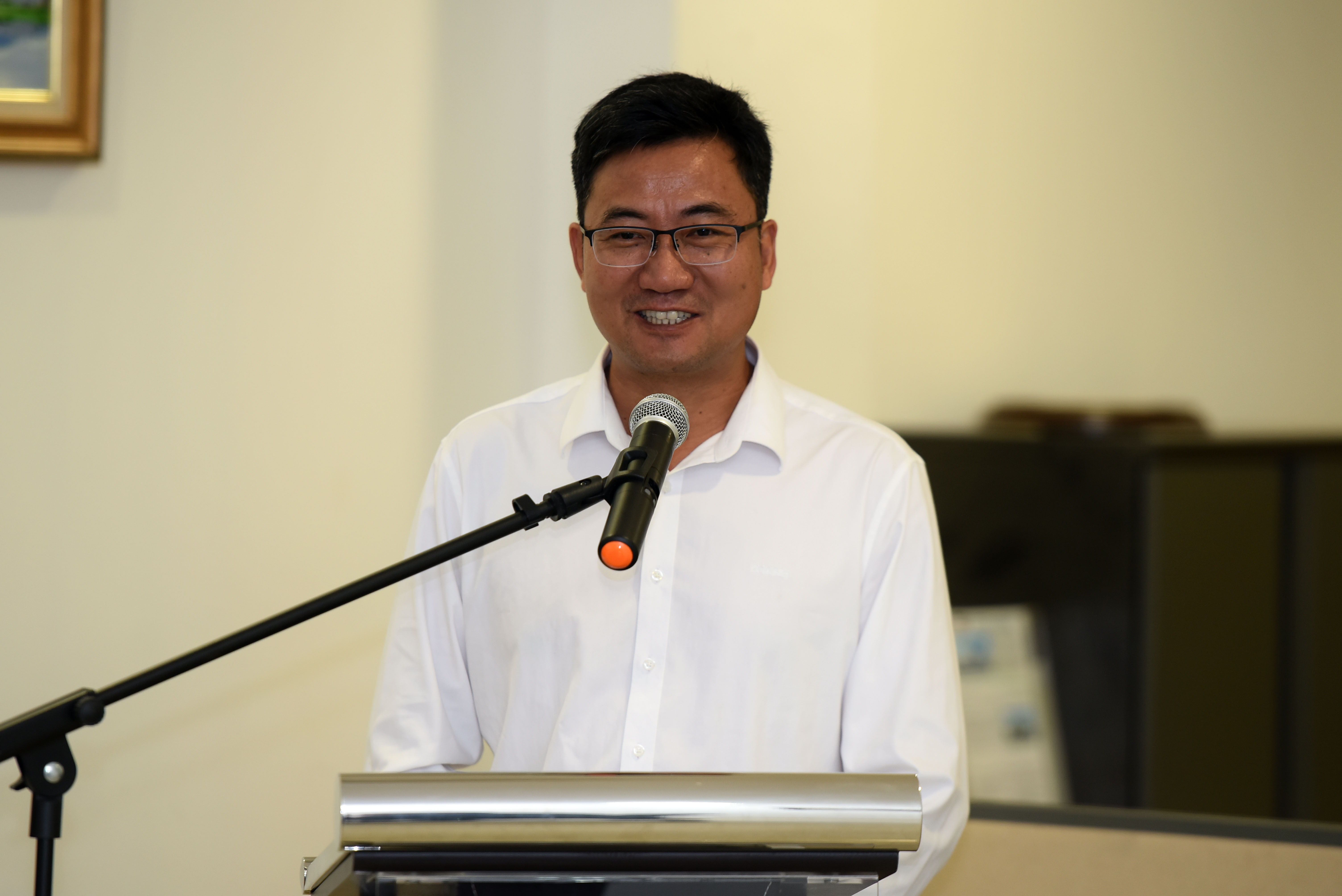 Mr Liang delivering his speech