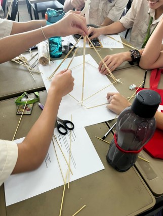 Students participating in Satay Stick Tower Design Challenge
