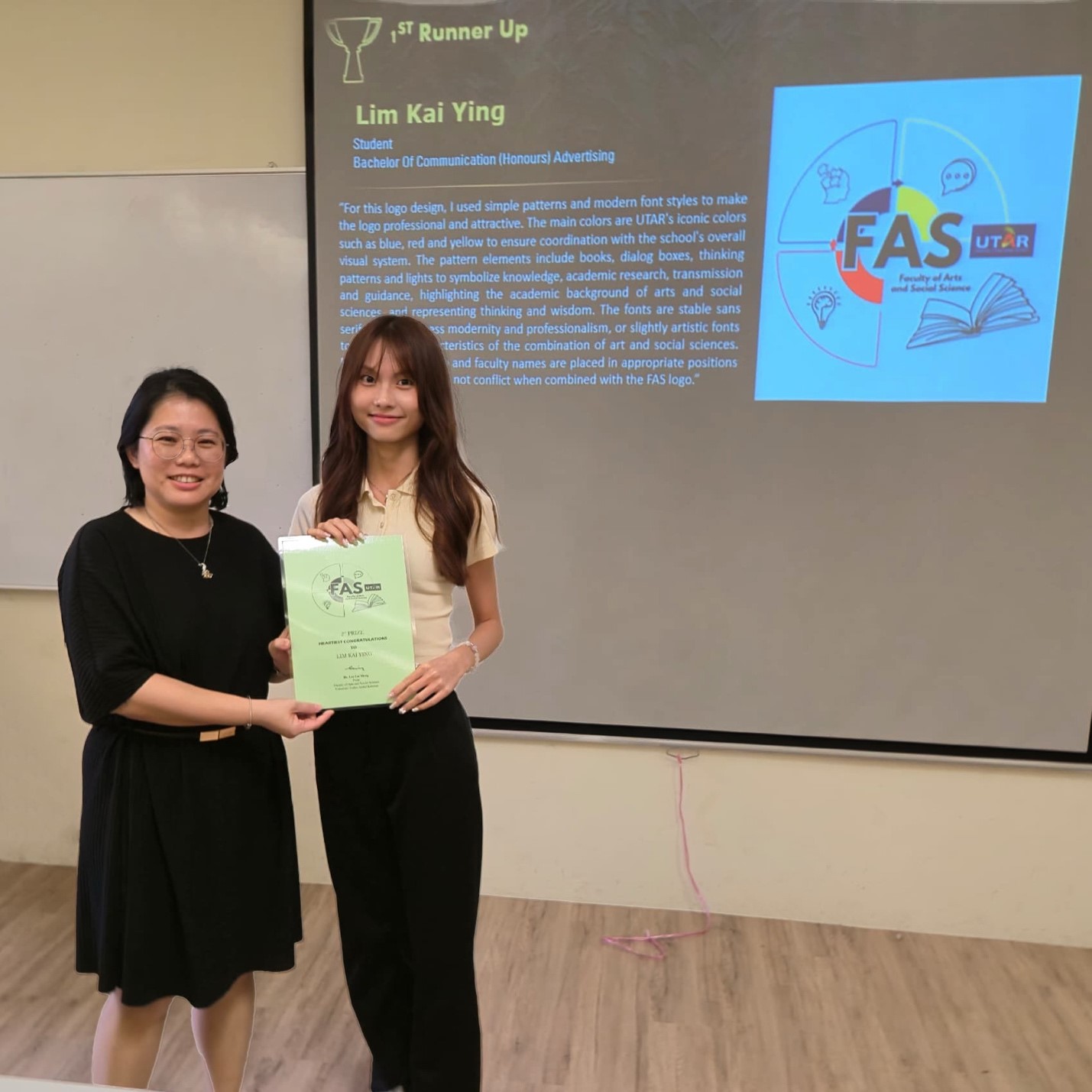 Ms Kok (left) presenting the award to Lim