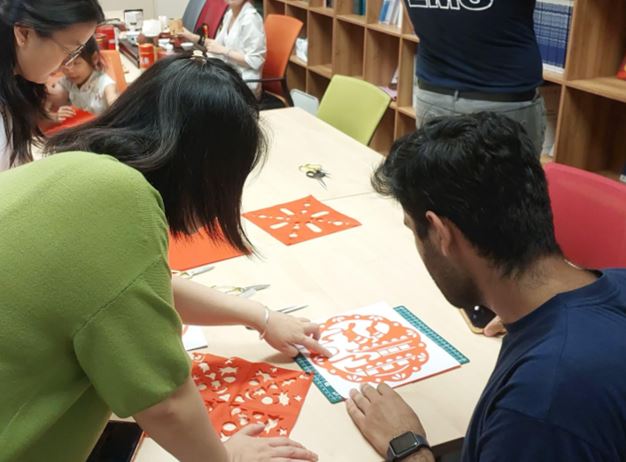 Participants experiencing Chinese culture through interactive hands-on activities