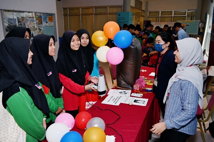 Students trying their hands on the various activities at the booths