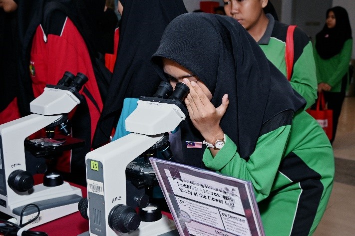 Students trying their hands on the various activities at the booths