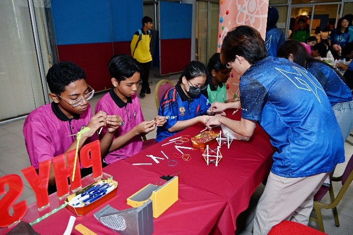 Students trying their hands on the various activities at the booths
