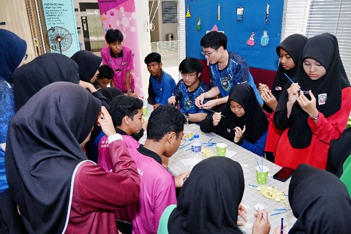 Students trying their hands on the various activities at the booths