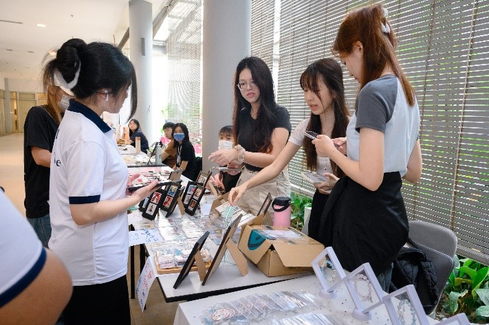 Participants thronging the booths outside of the Multipurpose Hall, indulging in a vibrant and diverse experience