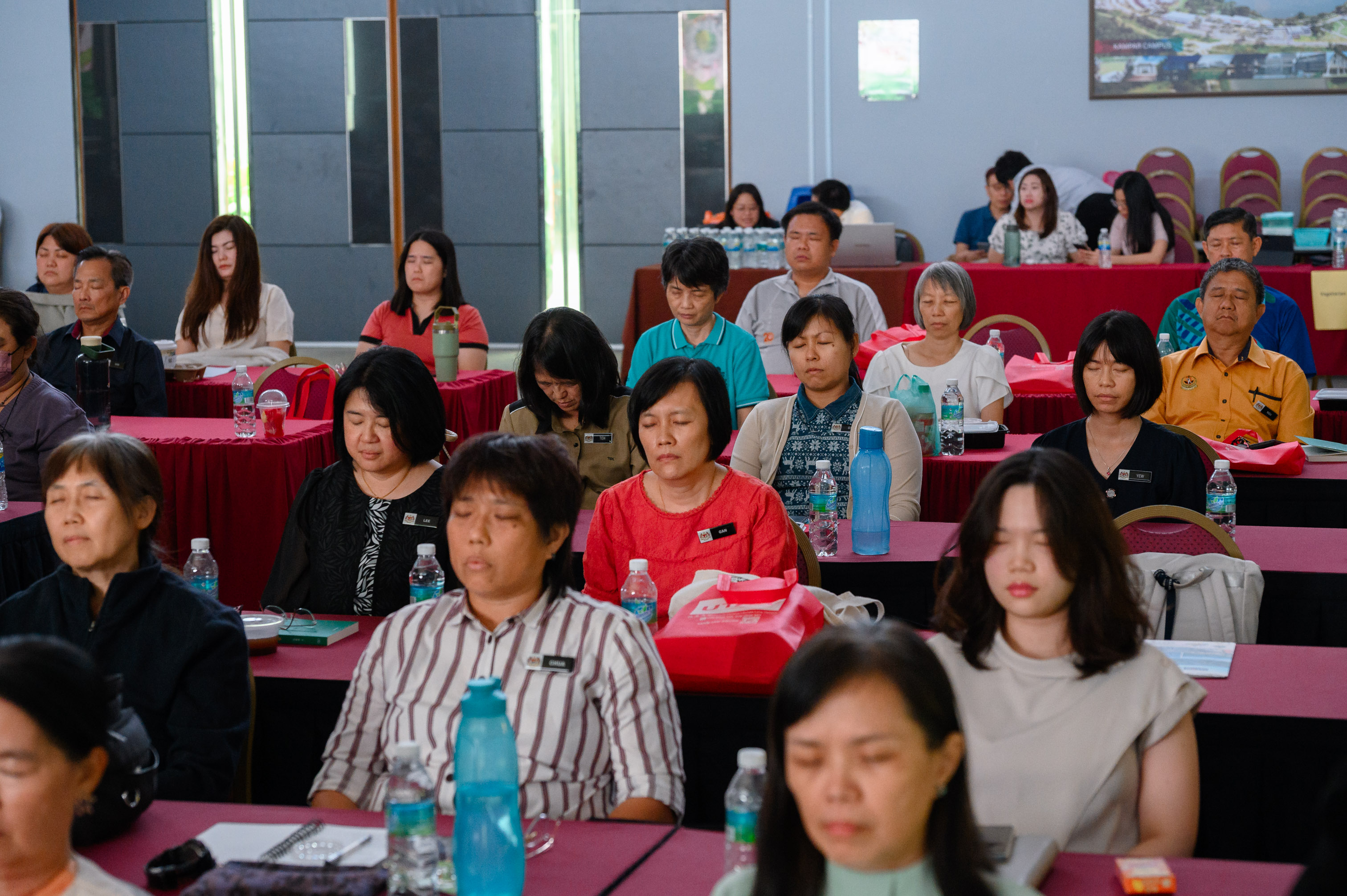 Venerable You Deng leading a mindfulness breathing practice session for the participants