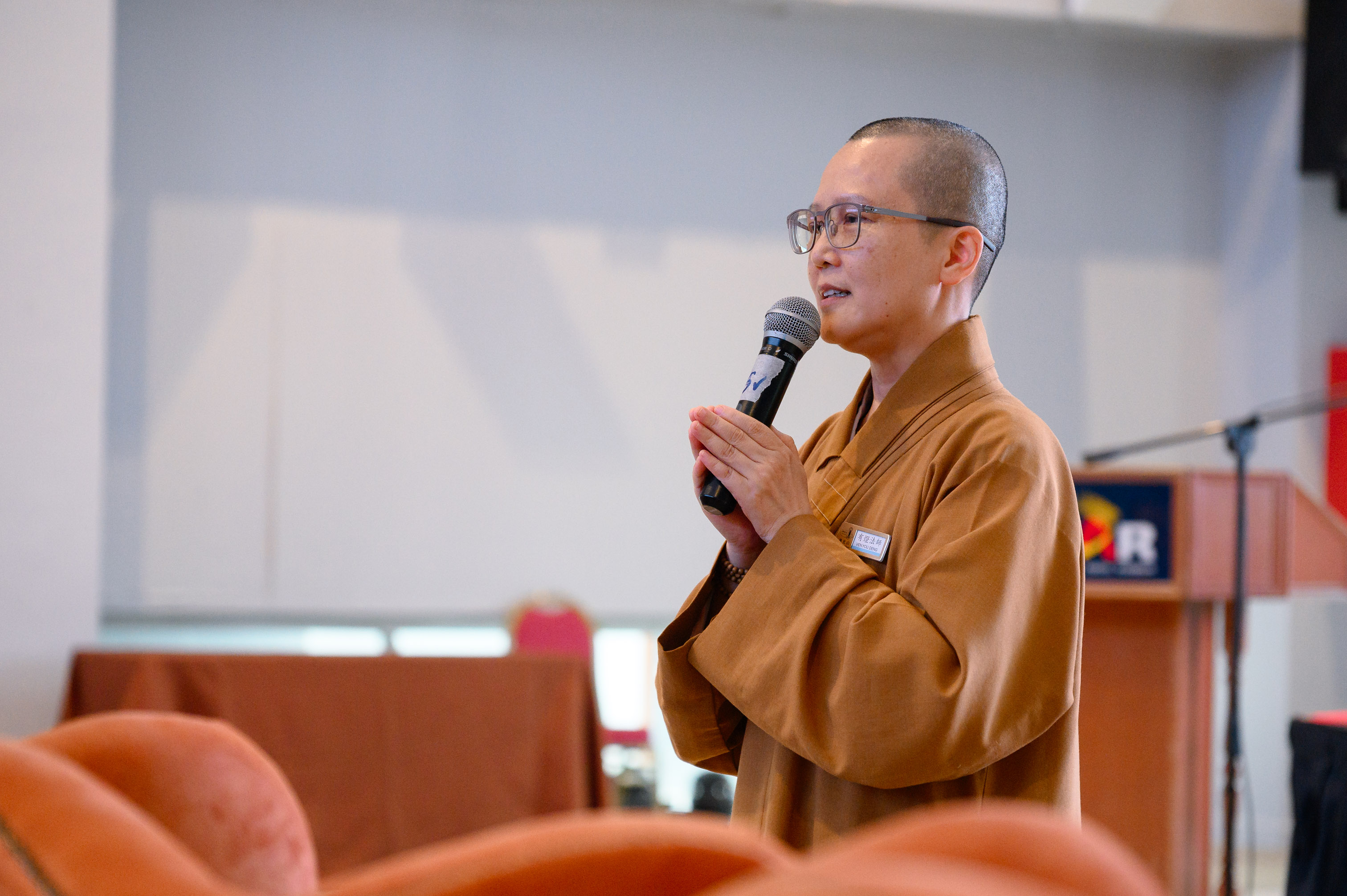 Venerable You Deng leading a mindfulness breathing practice session for the participants