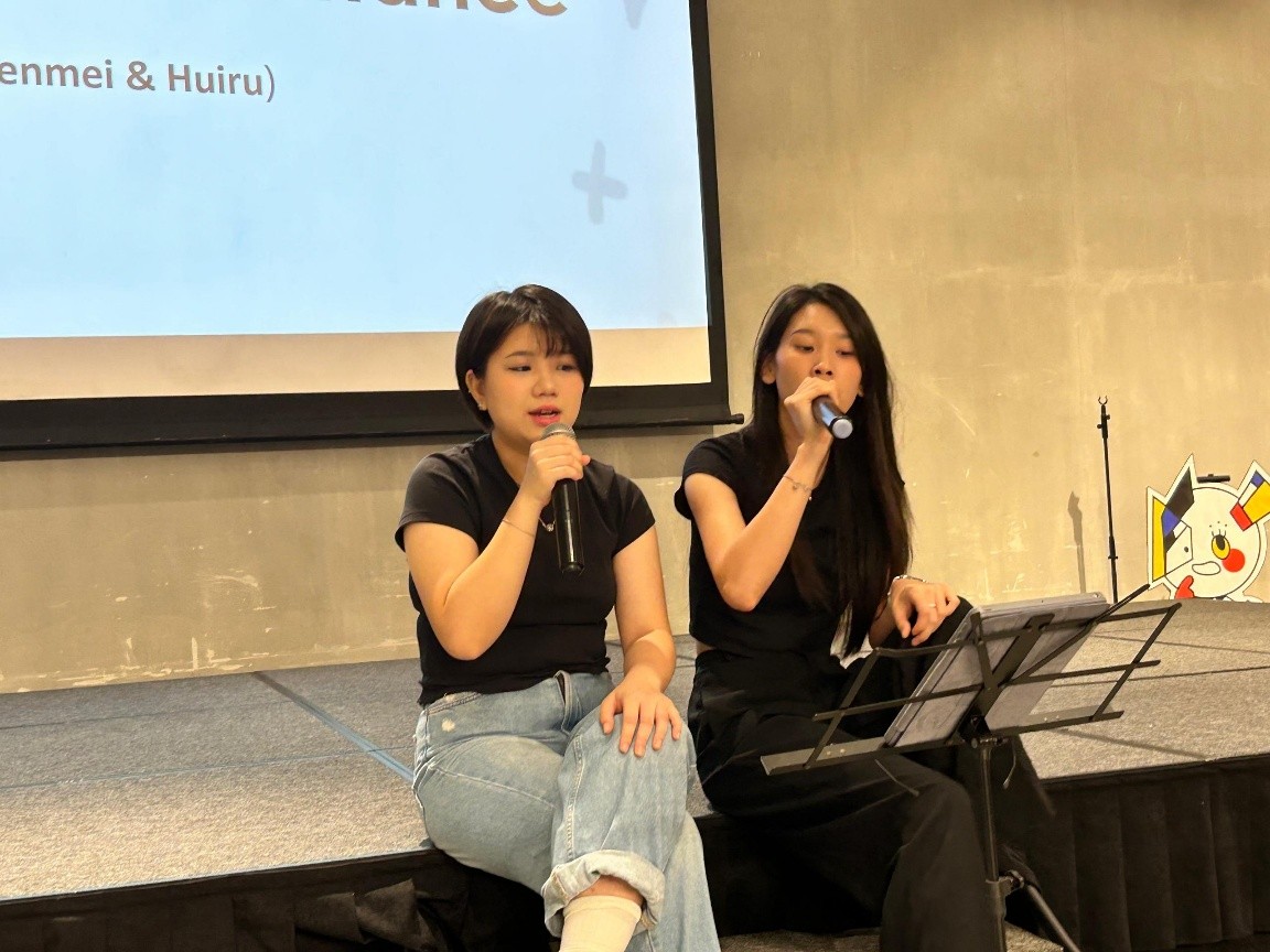 Singing performance by Yen Mei and Hui Ru