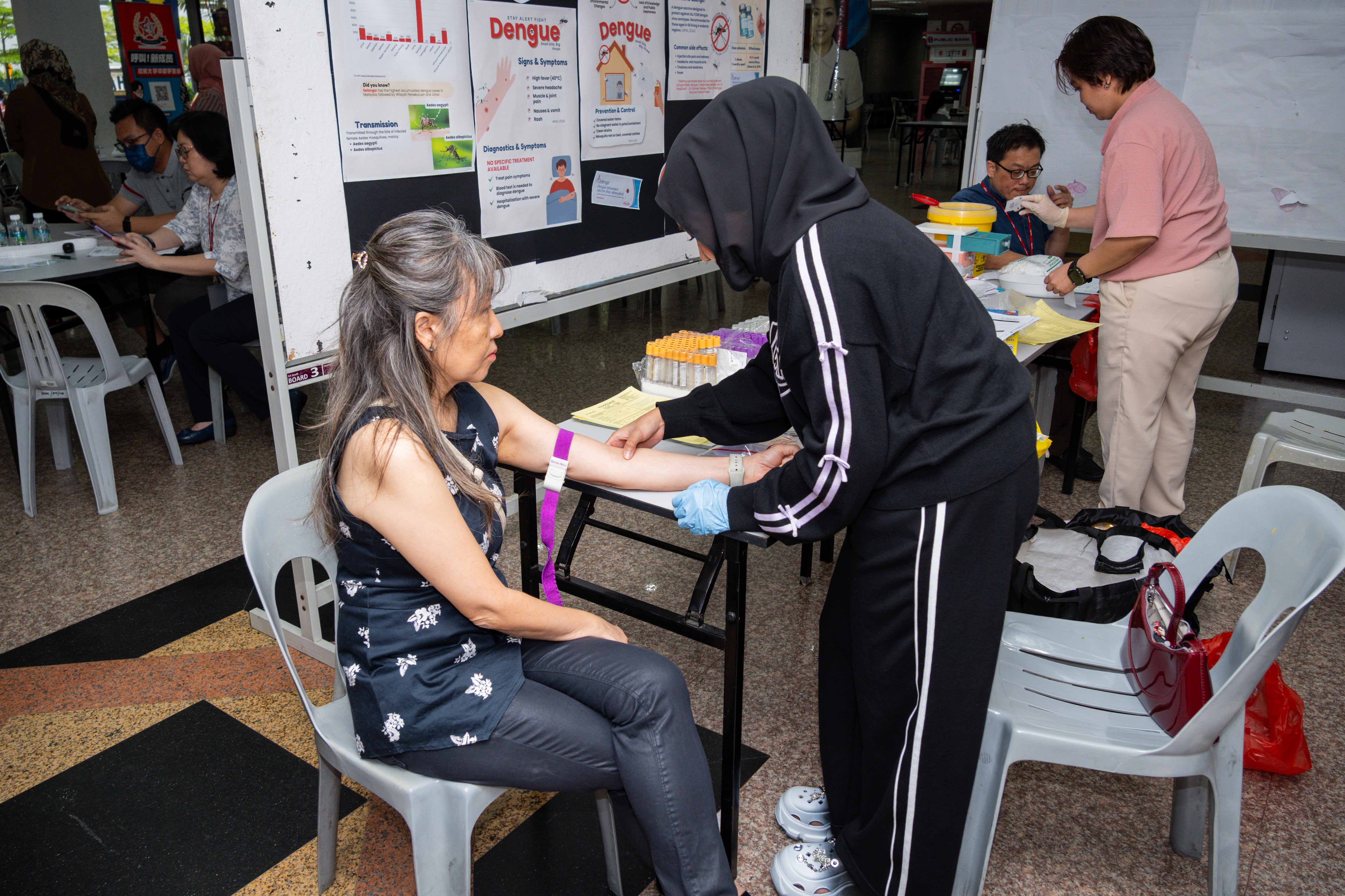 UTAR staff undergoing health screening at the South Lobby of UTAR Sungai Long Campus