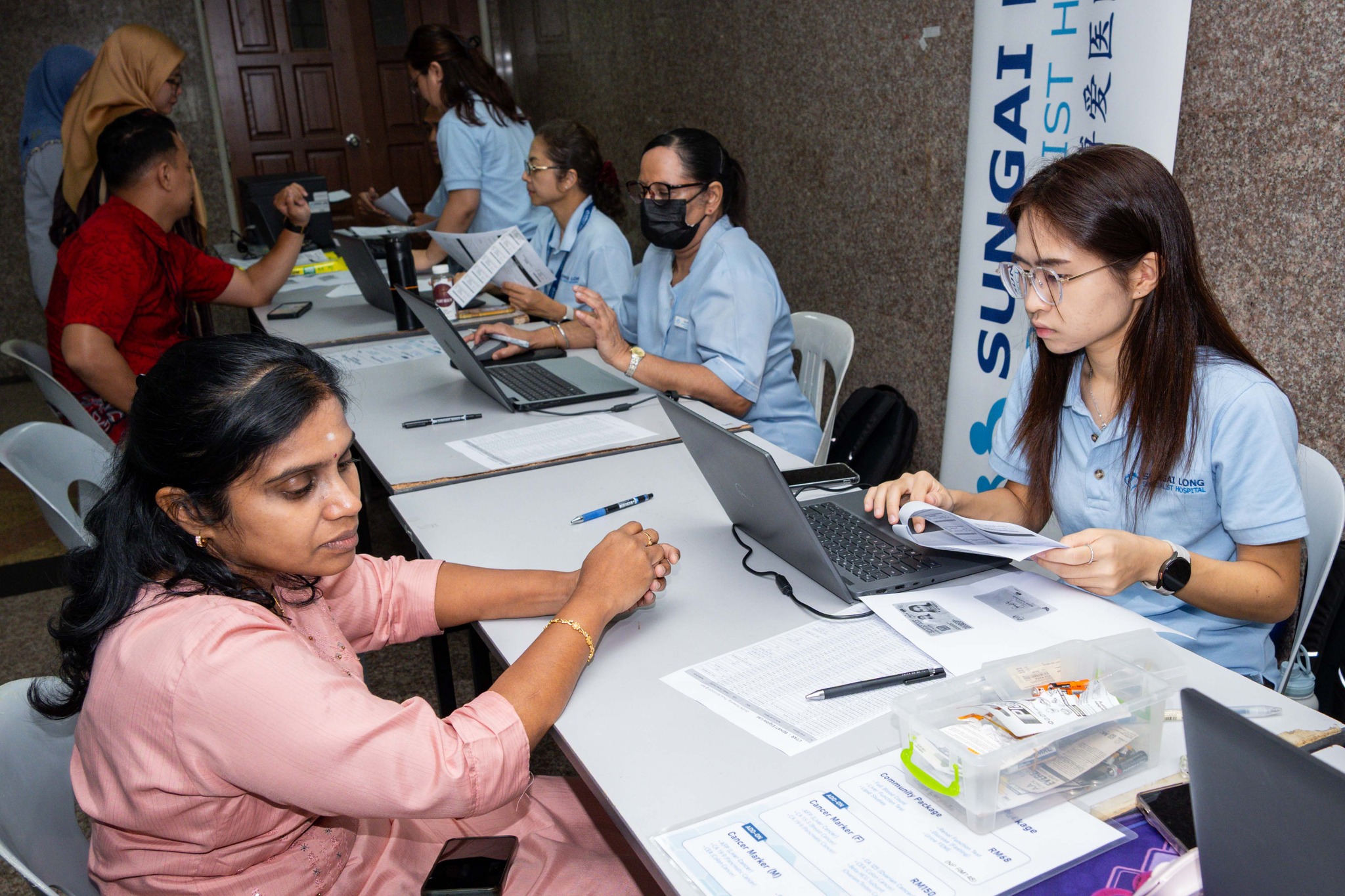 UTAR staff undergoing health screening at the South Lobby of UTAR Sungai Long Campus