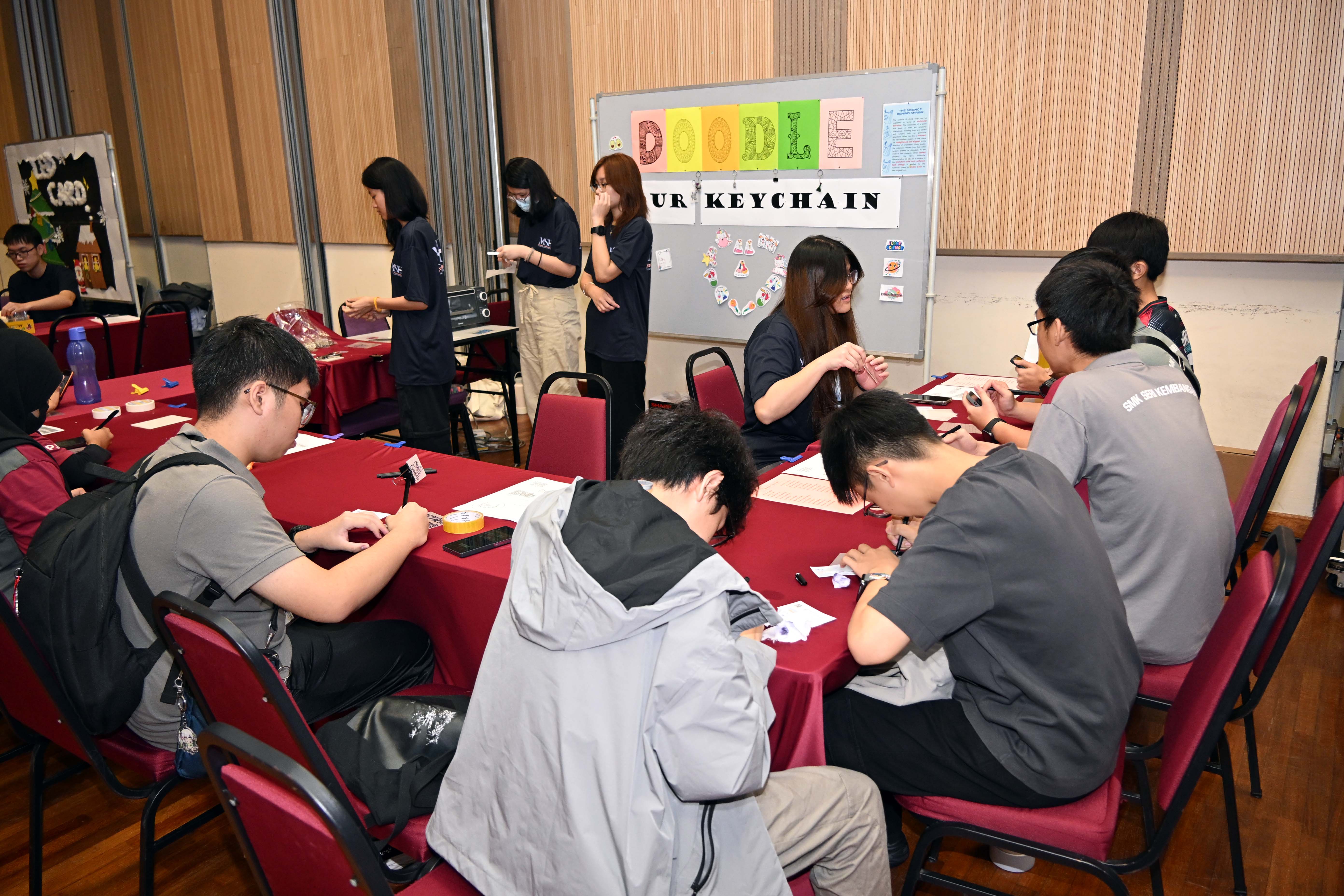 High schoolers participating in the activities in each booth
