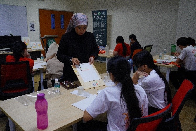 Students expressing creativity in the Watercolour Painting Workshop led by Puan Suriati