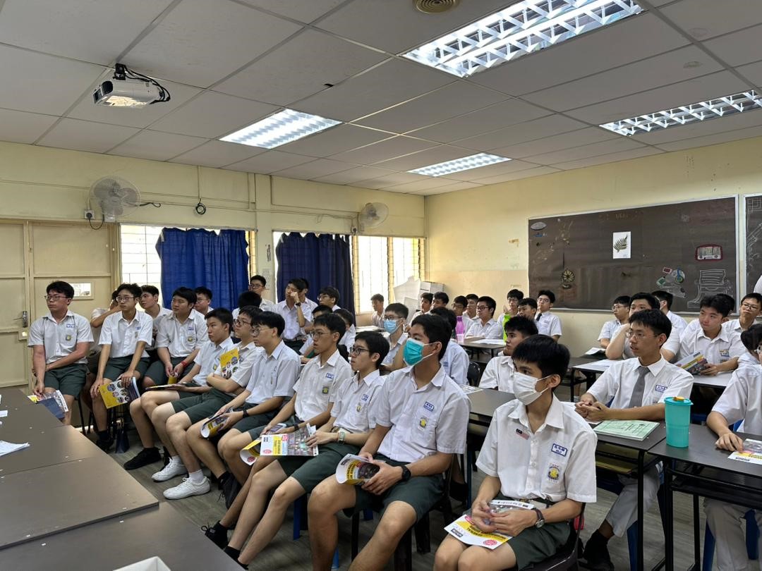 Students attentively listening to Ms Chai