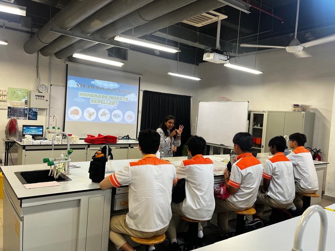 Ms Precilla demonstrating insect repellent activity 