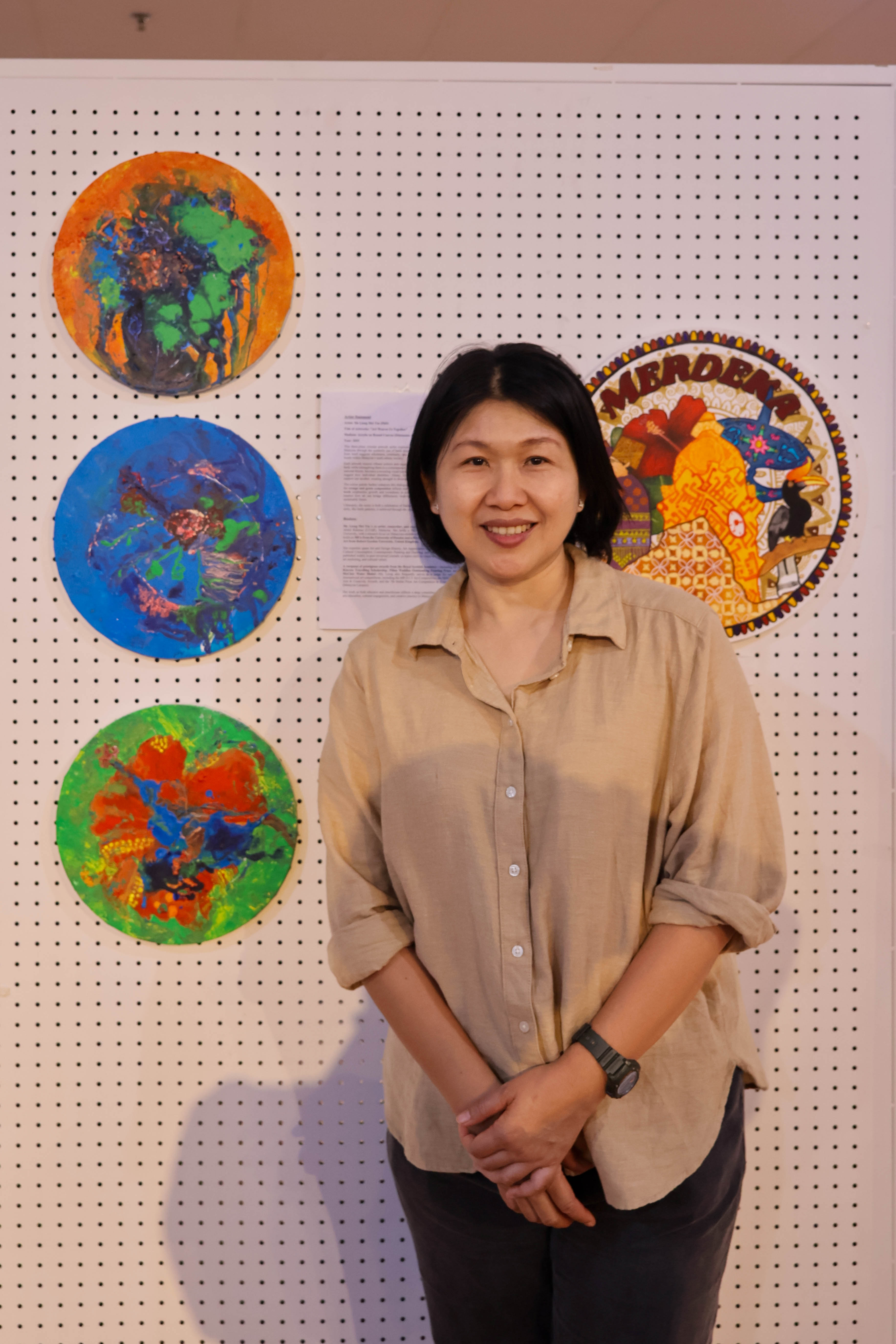 Dr Liong with her artwork
