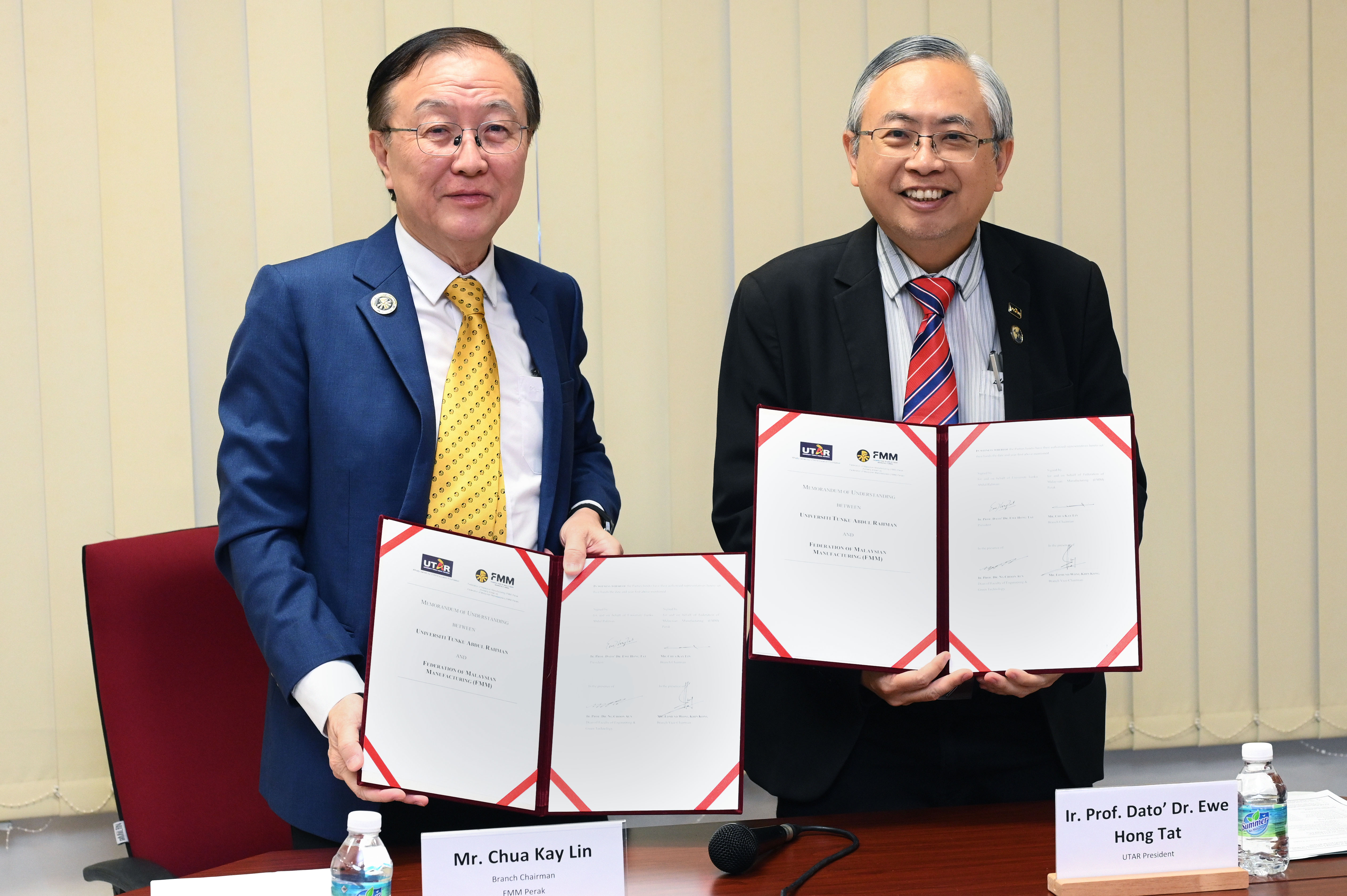 Prof Dato’ Ewe (right) and Mr Chua displaying the signed MoU